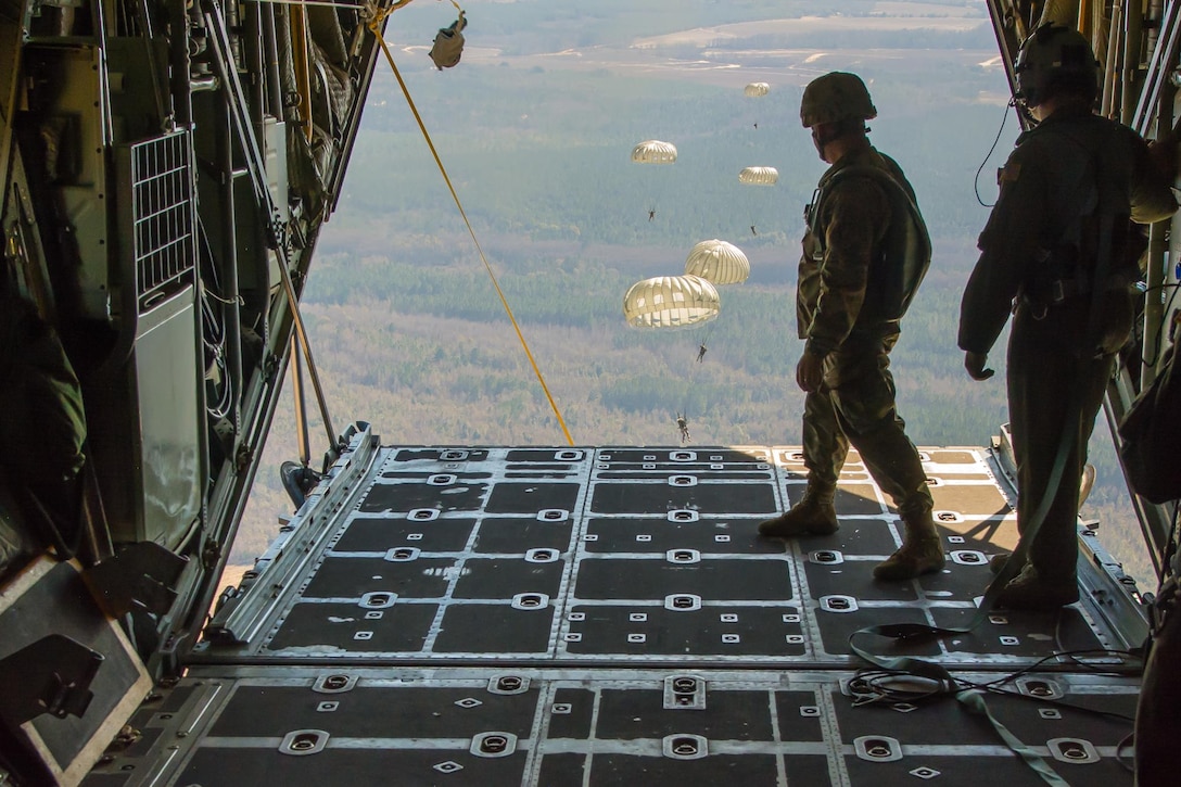 U.S. Soldiers assigned to the 421st Quartermaster Company, U.S. Army Reserve, perform a static line jump out of a C-130 Hercules belonging to the Missouri Air National Guard’s 180th Airlift Squadron over Sylvania, Ga., on January 10, 2017. 