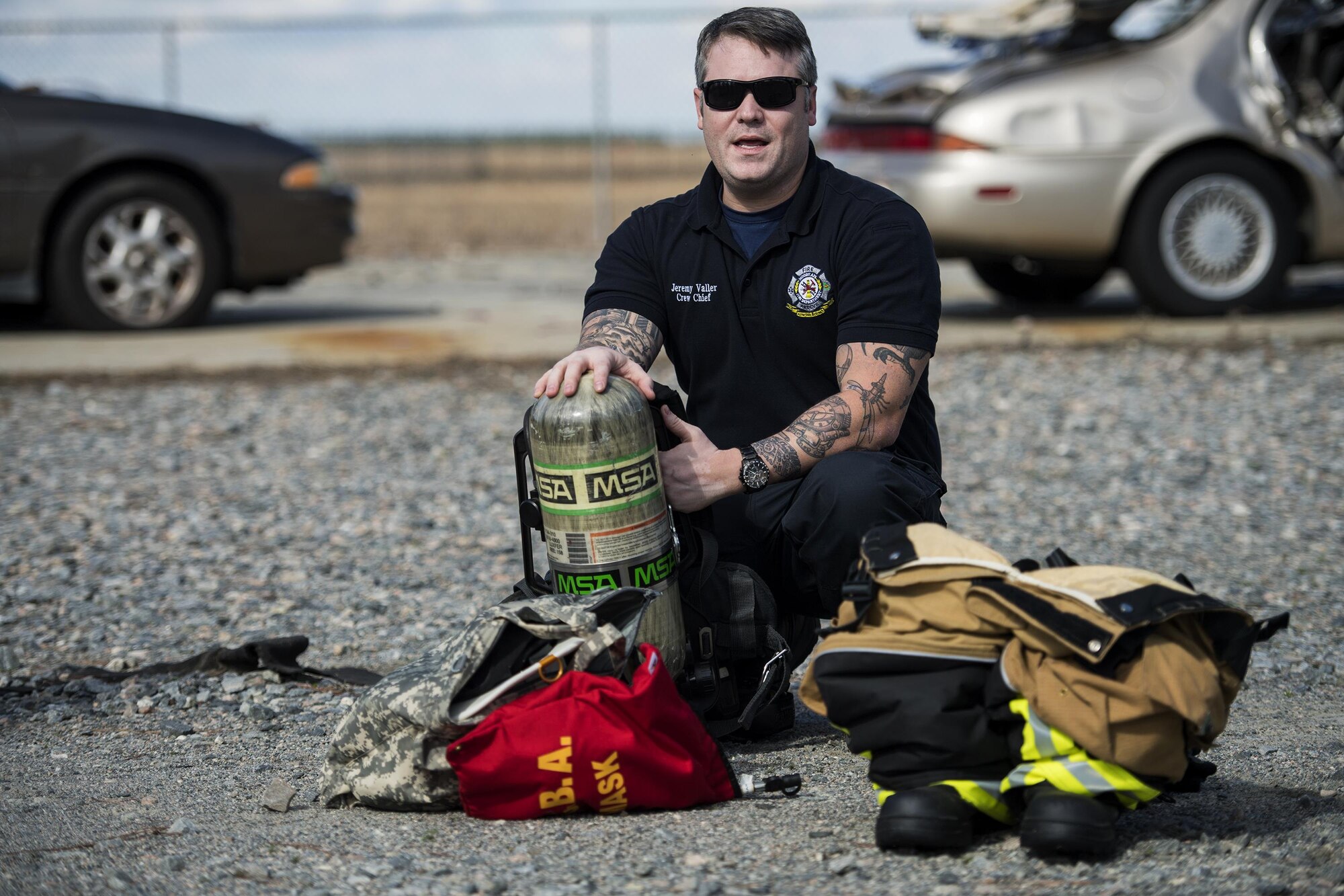 Jeremy Valler, 23d Civil Engineer Squadron crew chief, explains the uses of equipment that makes up the bunker gear, during Vehicle Extrication training, Jan. 13, 2017, at Moody Air Force Base, Ga. The bunker gear is used when fighting fires and during vehicle extrication to protect the wearer from debris and extreme temperatures. (U.S. Air Force photo by Airman 1st Class Janiqua P. Robinson)
