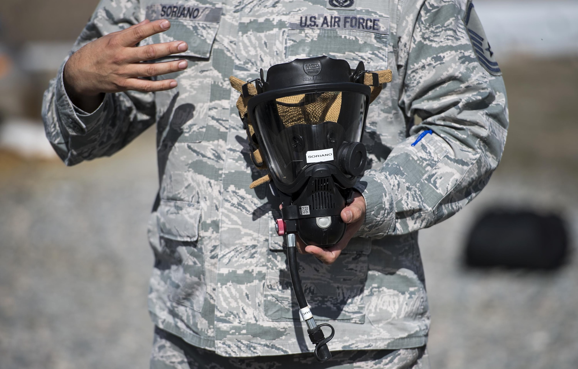 Master Sgt. Juan Soriano, 23d Civil Engineer Squadron explains why it’s important to wear the right gear, during Vehicle Extrication training, Jan. 13, 2017, at Moody Air Force Base, Ga. Soriano explained that the gear is so advanced and durable that it will be affected by the fire before the firefighter feels anything. (U.S. Air Force photo by Airman 1st Class Janiqua P. Robinson)