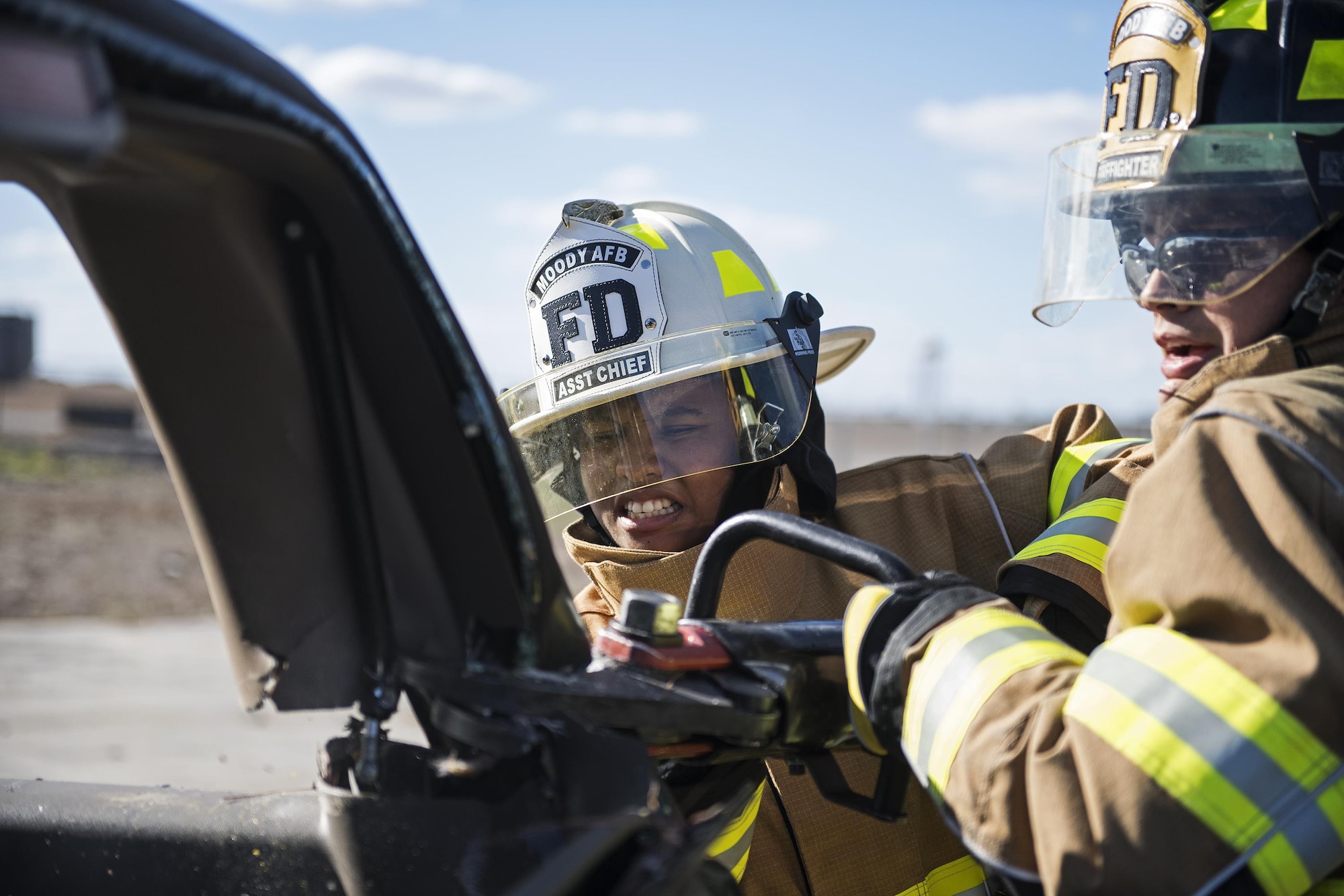 Senior Airman Gelisa Johnson, 23d Medical Operations Squadron uses a cutter, during Vehicle Extrication training, Jan. 13, 2017, at Moody Air Force Base, Ga. The cutter is strong enough to cut through sheet metal and hard plastic and is used on vehicles to free trapped passengers. (U.S. Air Force photo by Airman 1st Class Janiqua P. Robinson)