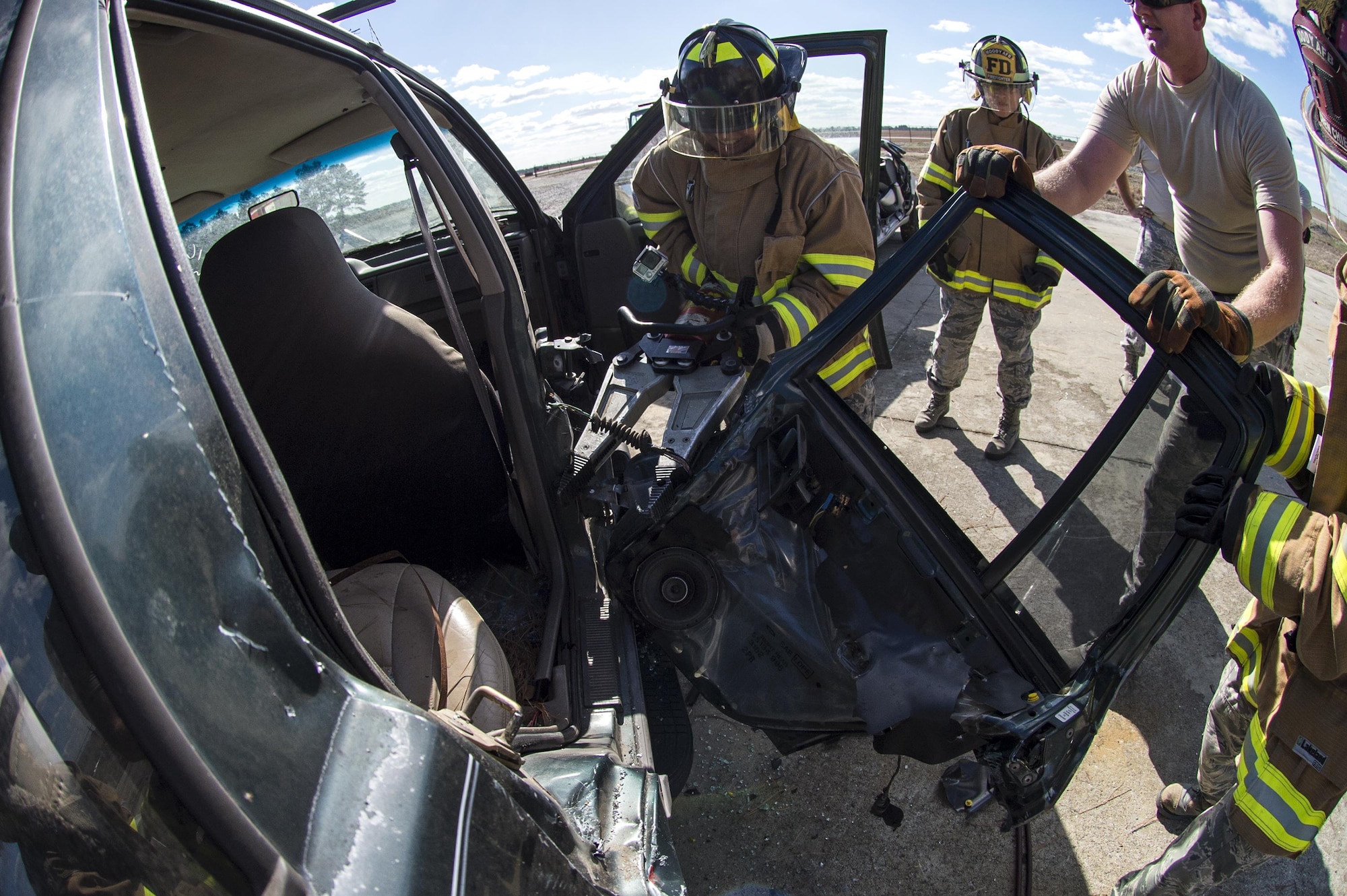 A participant uses a spreader, also known as the jaws of life, during Vehicle Extrication training, Jan. 13, 2017, at Moody Air Force Base, Ga. The spreader is used to pull pieces of the vehicle apart, but when removing doors, placement is just as important as power. (U.S. Air Force photo by Airman 1st Class Janiqua P. Robinson)
