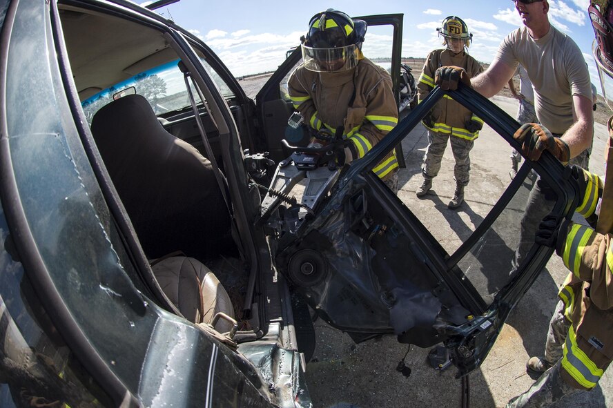 A participant uses a spreader, also known as the jaws of life, during Vehicle Extrication training, Jan. 13, 2017, at Moody Air Force Base, Ga. The spreader is used to pull pieces of the vehicle apart, but when removing doors, placement is just as important as power. (U.S. Air Force photo by Airman 1st Class Janiqua P. Robinson)
