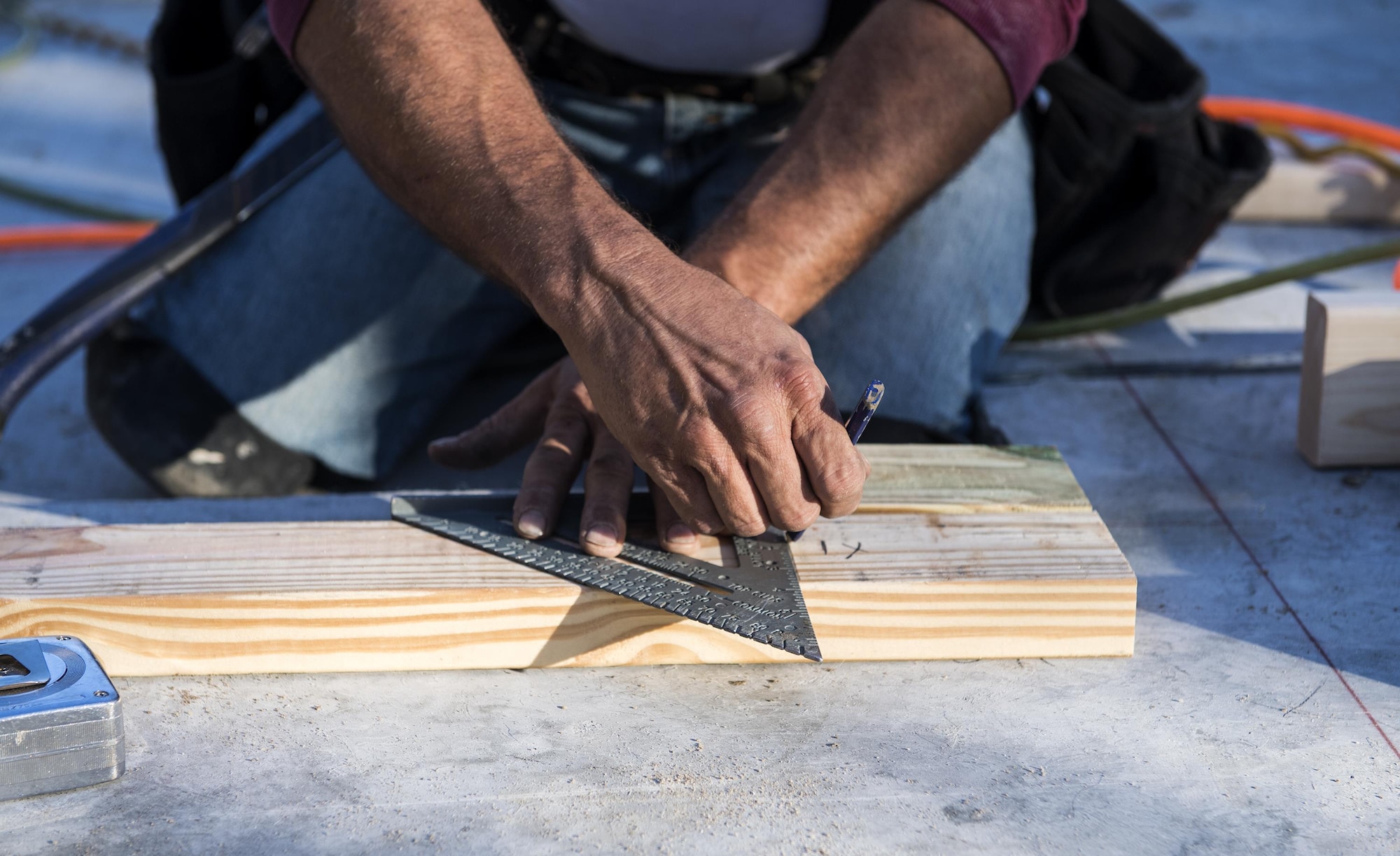 A volunteer measures wood for a home being built in support of Habitat for Humanity, Jan. 14, 2017, in Valdosta, Ga. This piece of wood was used in the frame for the front of a home the volunteers were building for a family in need. (U.S. Air Force photo by Airman 1st Class Janiqua P. Robinson)