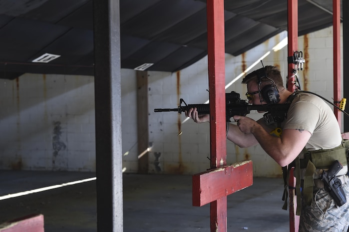 Staff Sgt. Alexander Elder, 628th Security Forces Squadron Combat Arms Training and Maintenance instructor, assists Wright-Patterson Air Force Base, Ohio, researchers by wearing equipment to analyze the fumes expended from the weapon when fired at the firing range, Nov. 17, 2016. The focus of the research is to determine if expended fumes are being properly ventilated on firing ranges.