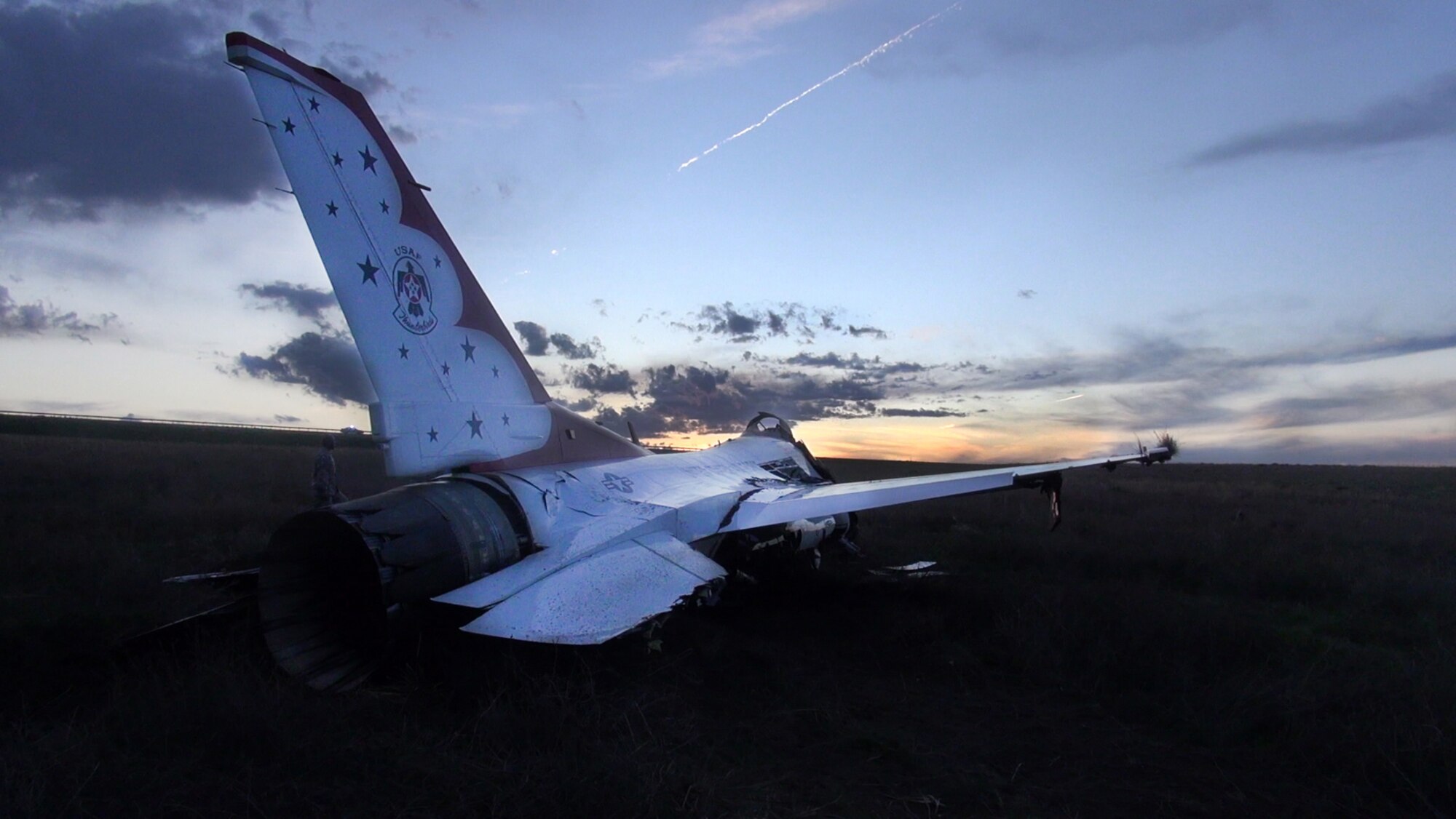 SECURITY-WIDEFIELD, Colo. – Thunderbird 6 lays in a field as the sun sets after it crashed in Security-Widefield, Colo., June, 2, 2016. (U.S. Air Force photo by Dave Meade)