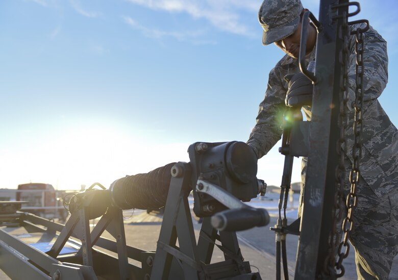 Airman 1st Class Christian Gray, an Aerial and Ground Equipment specialist assigned to the 28th Maintenance Squadron, locks the brake on a piece of equipment, Jan. 17, 2017, at Ellsworth Air Force Base, S.D. In two days, Airmen from the Logistics Readiness Squadron and the 28th LRS Travel Management Office loaded approximately 321k pounds of equipment to be used at Red Flag—an Air Force-wide exercise testing air-to-air combat. (U.S. Air Force photo by Airman 1st Class Randahl J. Jenson)