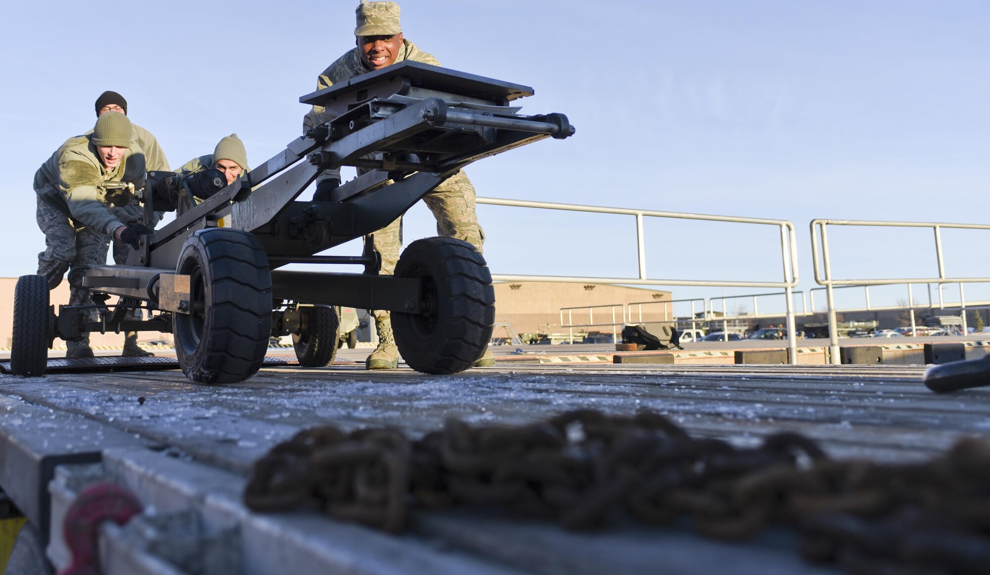 Airmen from the 28th Logistics Readiness Squadron and the 28th LRS Travel Management Office load equipment onto a truck Jan. 17, 2017, at Ellsworth Air Force Base, S.D. The platforms, generators, flood lights and other equipment loaded will be used at Red Flag 17-1—an Air Force-wide exercise testing air-to-air combat. (U.S. Air Force photo by Airman 1st Class Randahl J. Jenson)