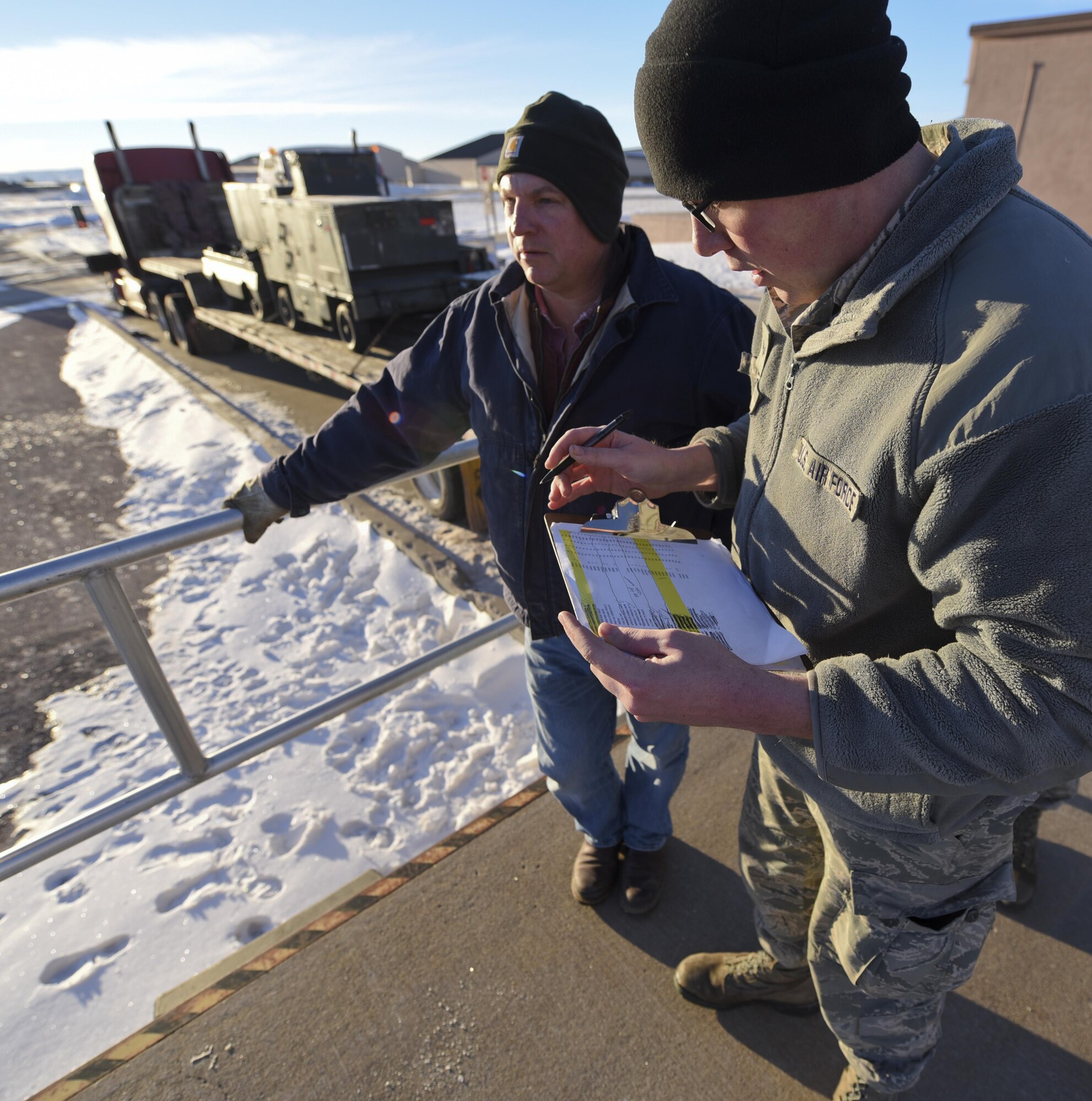 Senior Airman Matthew Nielson, a logistic specialist assigned to the 28th Logistic Readiness Squadron, checks a loading schedule Jan. 17, 2017, at Ellsworth Air Force Base, S.D. Airmen from the 28th LRS and the 28th LRS Travel Management Office loaded approximately 321k pounds of equipment onto 17 trucks in two days. (U.S. Air Force photo by Airman 1st Class Randahl J. Jenson)