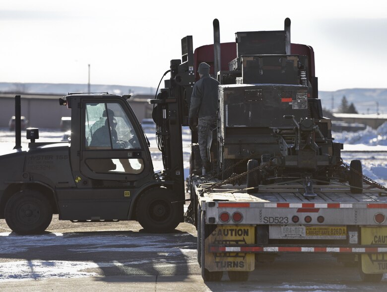 Airmen from the 28th Logistics Readiness Squadron and the 28th LRS Travel Management Office load equipment onto a truck Jan. 17, 2017, at Ellsworth Air Force Base, S.D. In two days, Airmen from LRS and TMO loaded approximately 321k pounds of equipment to be used at Red Flag—an Air Force-wide exercise testing air-to-air combat. (U.S. Air Force photo by Airman 1st Class Randahl J. Jenson)