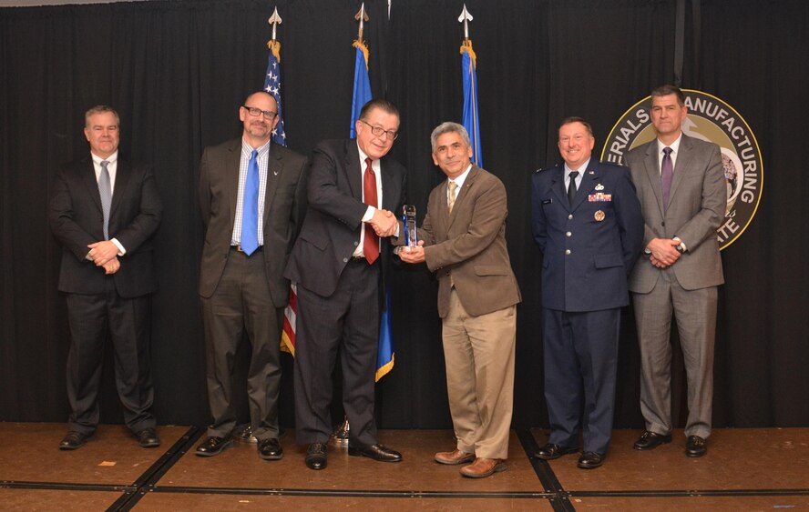 Michael Cleary presented Dr. Benji Maruyama with the Charles J. Cleary Scientific Award, the highest honor bestowed at the 64th Annual Materials and Manufacturing Directorate Awards Luncheon. Pictured from left to right are Dr. Chuck Ward, Dr. Timothy Bunning, Michael Cleary, Dr. Benji Maruyama, Col. Charles Ormsby, and Dr. Larry Butkus.  (U.S. Air Force Photo/David Dixon)