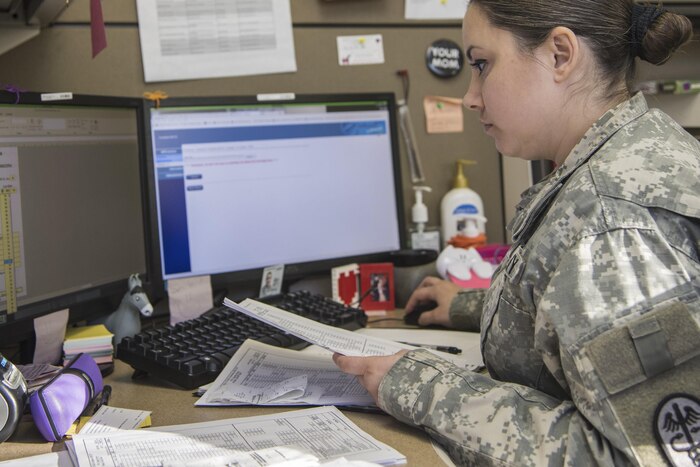 Army Staff Sgt. Valerie Garvin, an animal care specialist with the Public Health Command District, budgets the veterinary treatment facility income at Joint Base Andrews, Md., Dec. 20, 2016. As an animal care specialist, she manages everything in the facility, including budgets, medications and patients. Air Force photo by Airman 1st Class Valentina Lopez