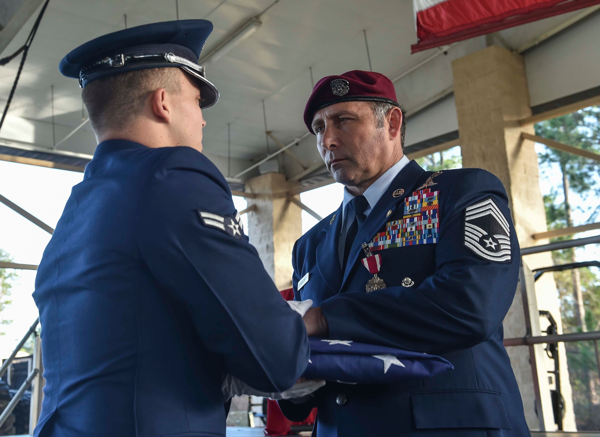 Chief Master Sgt. Davide Keaton, 26th Special Tactics Squadron superintendent, receives a folded flag from the Hurlburt Field Honor Guard during his retirement ceremony at Hurlburt Field, Fla., Jan. 12, 2017. Keaton served in the Air Force for 30 years as a law enforcement specialist and pararescueman. (U.S. Air Force photo by Senior Airman Ryan Conroy) 