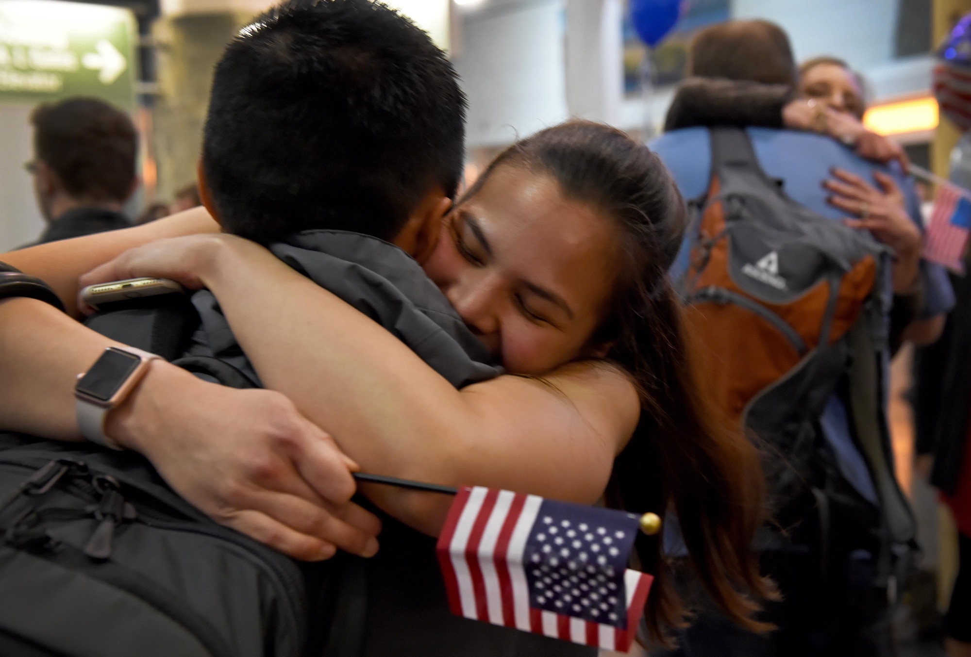 Sonia Munn embraces her spouse following his return from a deployment at the Ted Stevens International Airport, Anchorage, Alaska, Jan. 13, 2017. A group of service members of the 302d Fighter Squadron and the 525th Fighter Squadron returned from a deployment to Southwest Asia. 