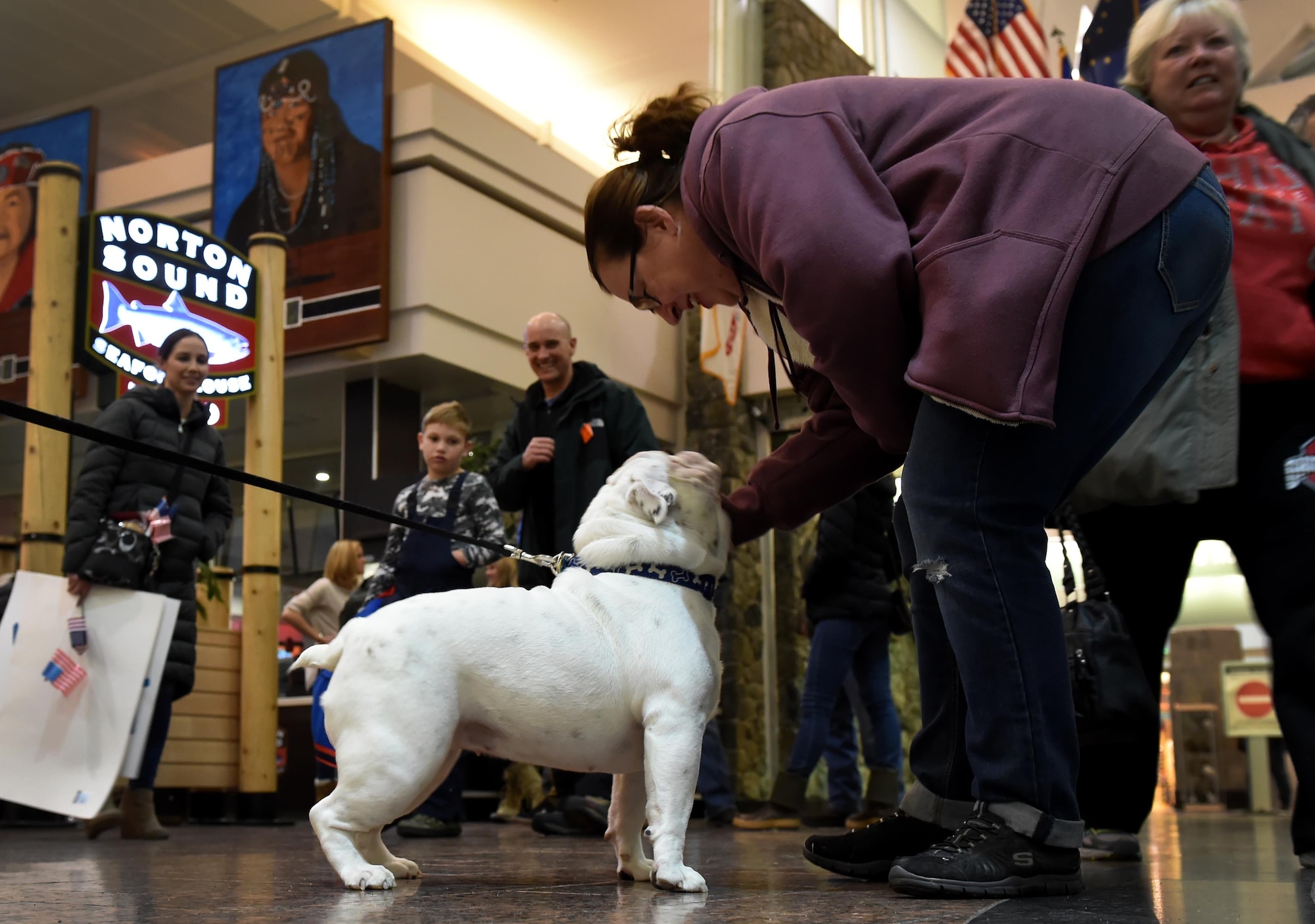 Blue, the 525th Fighter Squadron mascot, greets people at the Ted Stevens International Airport, Anchorage, Alaska, Jan. 13, 2016. Airmen of the 302d Fighter Squadron and the 525th Fighter Squadron returned from a deployment to Southwest Asia. 