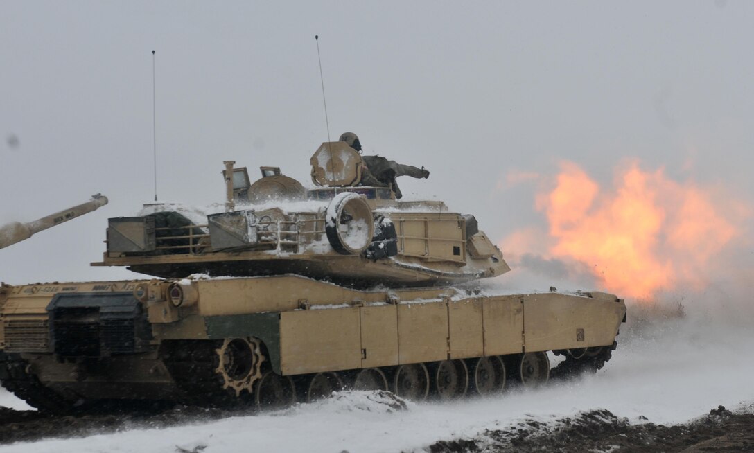 A round is fired from a U.S. Army M1A2 tank belonging to 1st Battalion, 68th Armor Regiment, 3rd Armored Brigade Combat Team, 4th Infantry Division, during the first Live Fire Accuracy Screening Tests at Presidential Range in Swietozow, Poland, January 16, 2017. The arrival of 3rd Arm. Bde. Cmbt. Tm., 4th Inf. Div., marks the start of back-to-back rotations of armored brigades in Europe as part of Atlantic Resolve. The vehicles and equipment, totaling more than 2,700 pieces, were shipped to Poland for certification before being deployed across Europe for use in training with partner nations. This rotation will enhance deterrence capabilities in the region, improve the U.S. ability to respond to potential crises and defend allies and partners in the European community. U.S. forces will focus on strengthening capabilities and sustaining readiness through bilateral and multinational training and exercises. (Photo by Staff Sgt. Elizabeth Tarr)