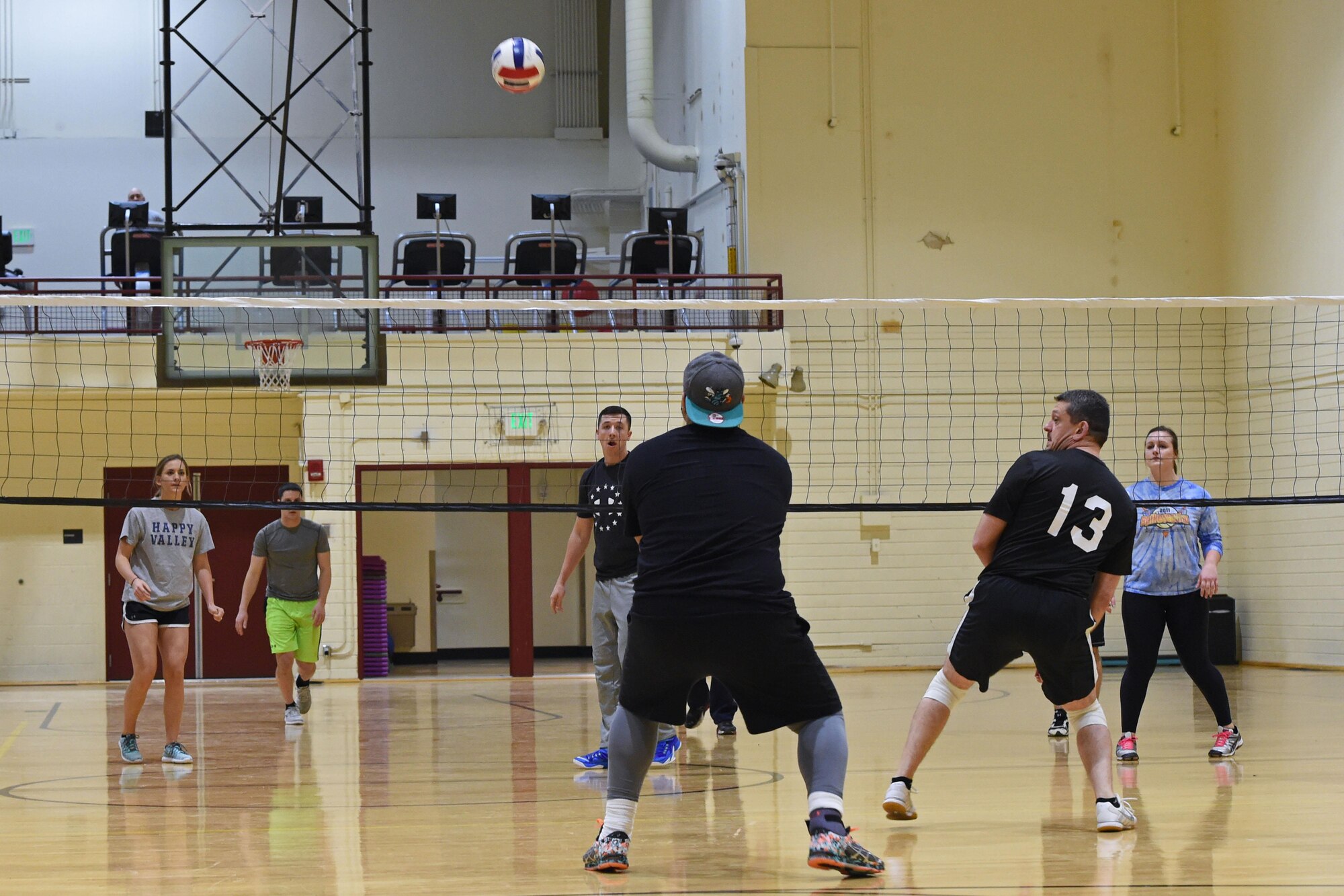 Service members participate in a volleyball tournament hosted at the Joint Base Elmendorf-Richardson Fitness Center, Jan. 12, 2017. Six teams competed in the event and prizes were awarded to first and second place as well the best-dressed team. 