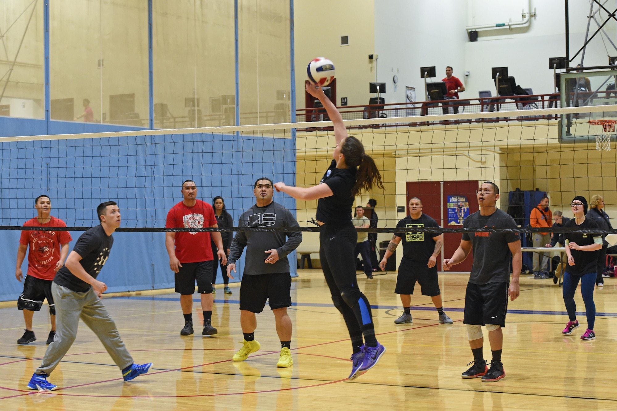 Service members participate in a volleyball tournament hosted at the Joint Base Elmendorf-Richardson Fitness Center, Jan. 12, 2017. Six teams competed in the event and prizes were awarded to first and second place as well the best-dressed team. 