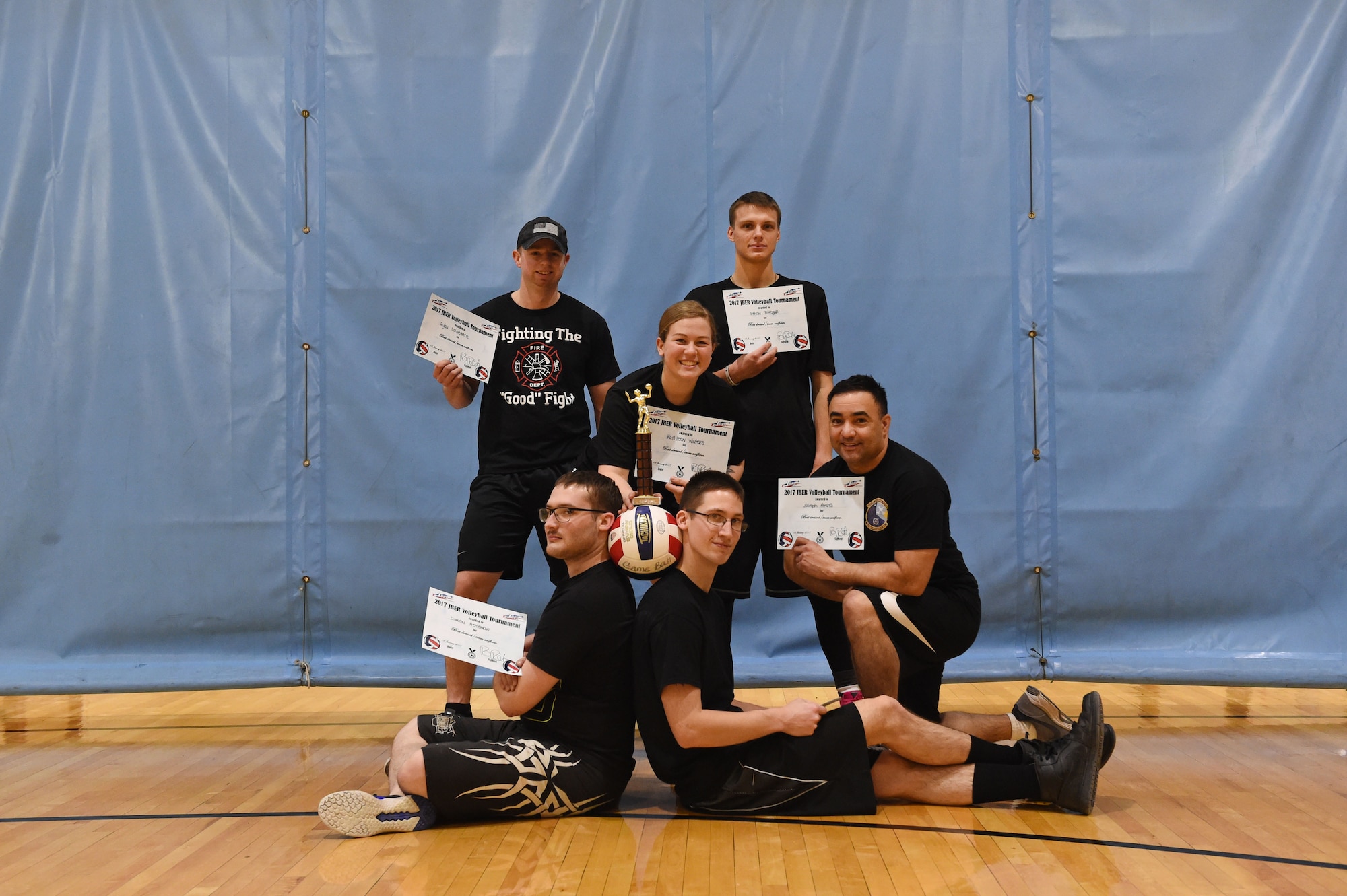 Service members participate in a volleyball tournament hosted at the Joint Base Elmendorf-Richardson Fitness Center, Jan. 12, 2017. Six teams competed in the event and prizes were awarded to first and second place as well the best-dressed team. 