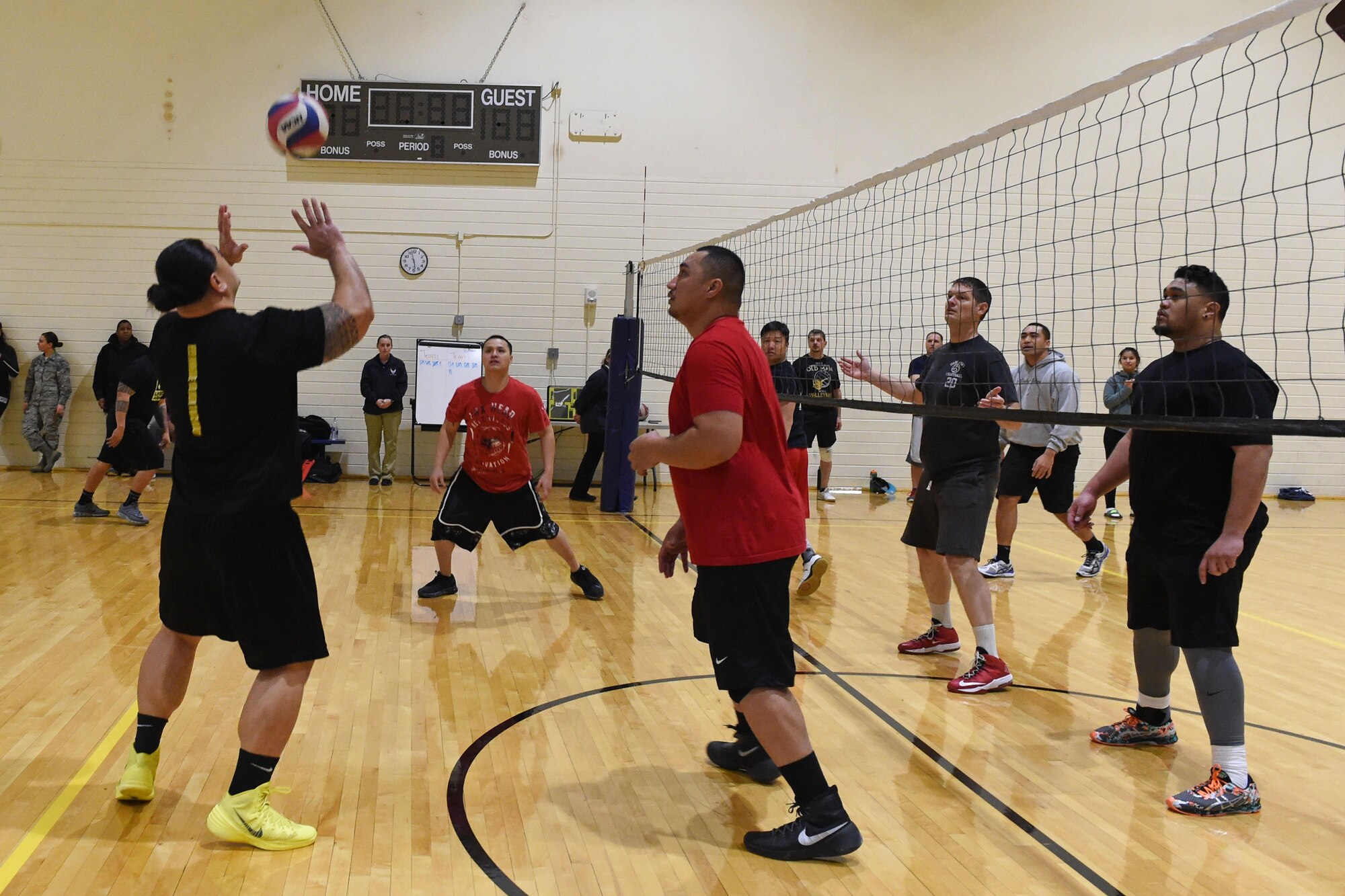 Service members participate in a volleyball tournament hosted at the Joint Base Elmendorf-Richardson Fitness Center, Jan. 12, 2017. Six teams competed in the event and prizes were awarded to first and second place as well the best-dressed team. 