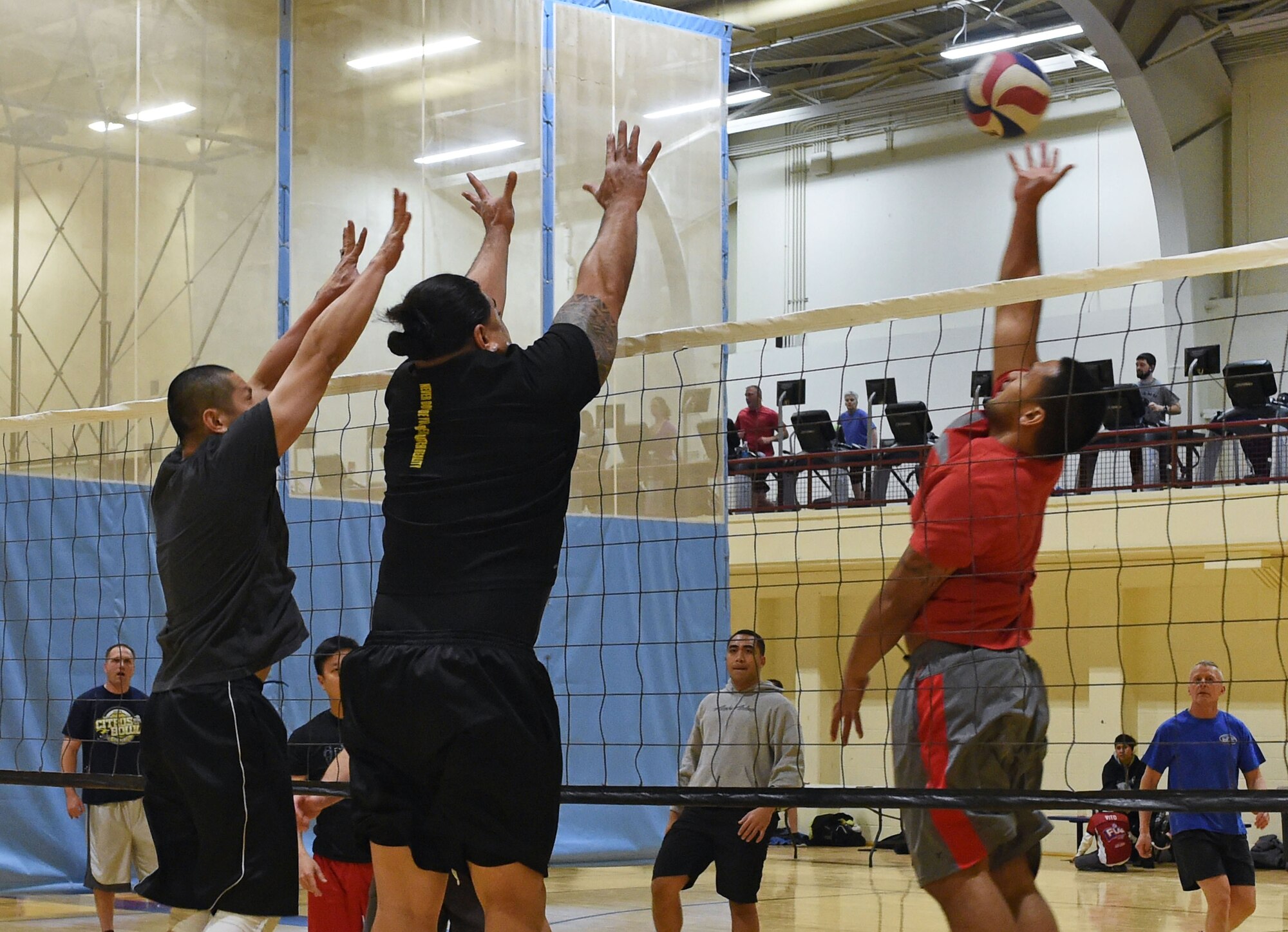 Service members participate in a volleyball tournament hosted at the Joint Base Elmendorf-Richardson Fitness Center, Jan. 12, 2017. Six teams competed in the event and prizes were awarded to first and second place as well the best-dressed team. 