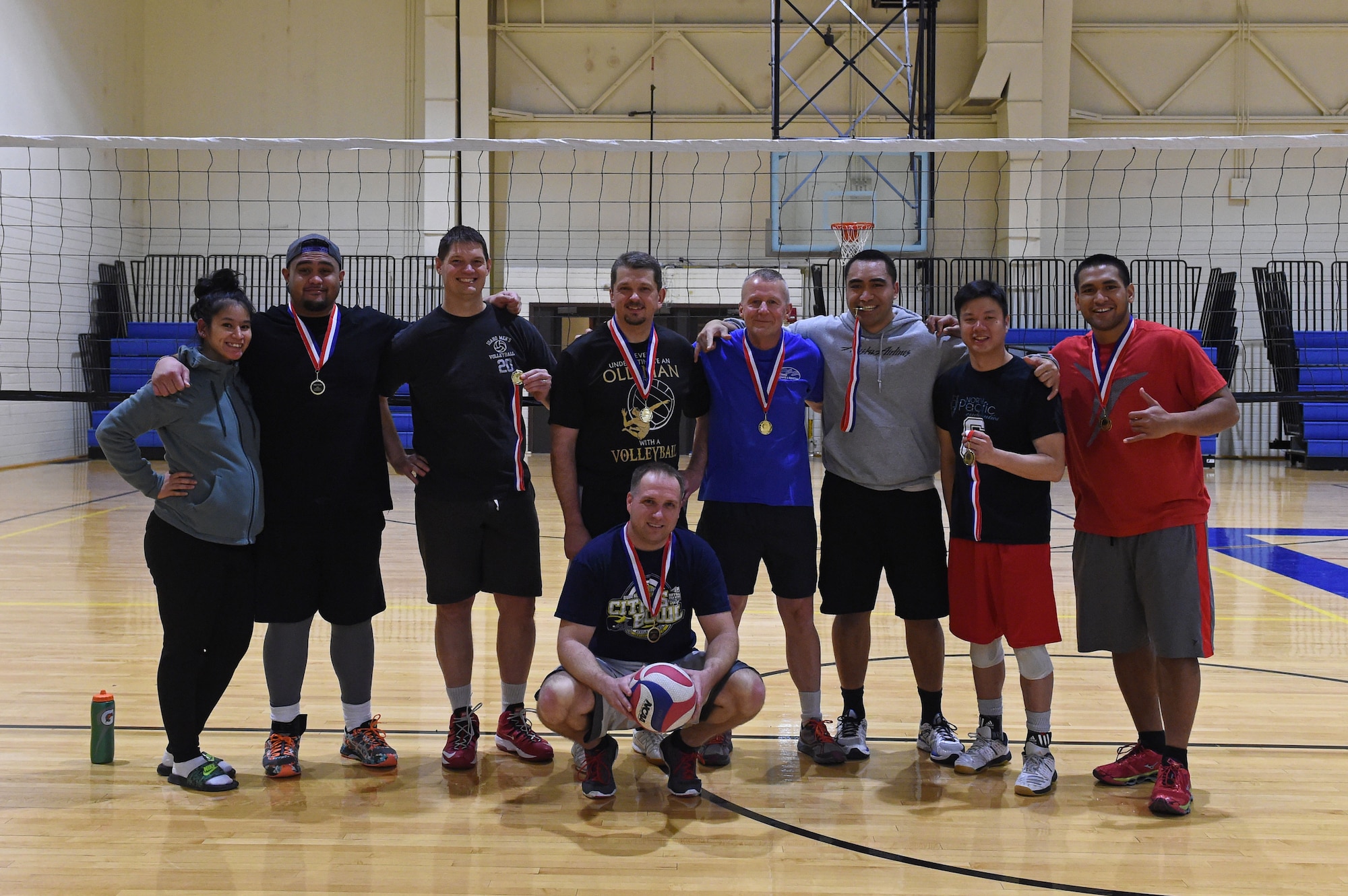 Service members participate in a volleyball tournament hosted at the Joint Base Elmendorf-Richardson Fitness Center, Jan. 12, 2017. Six teams competed in the event and prizes were awarded to first and second place as well the best-dressed team. 
