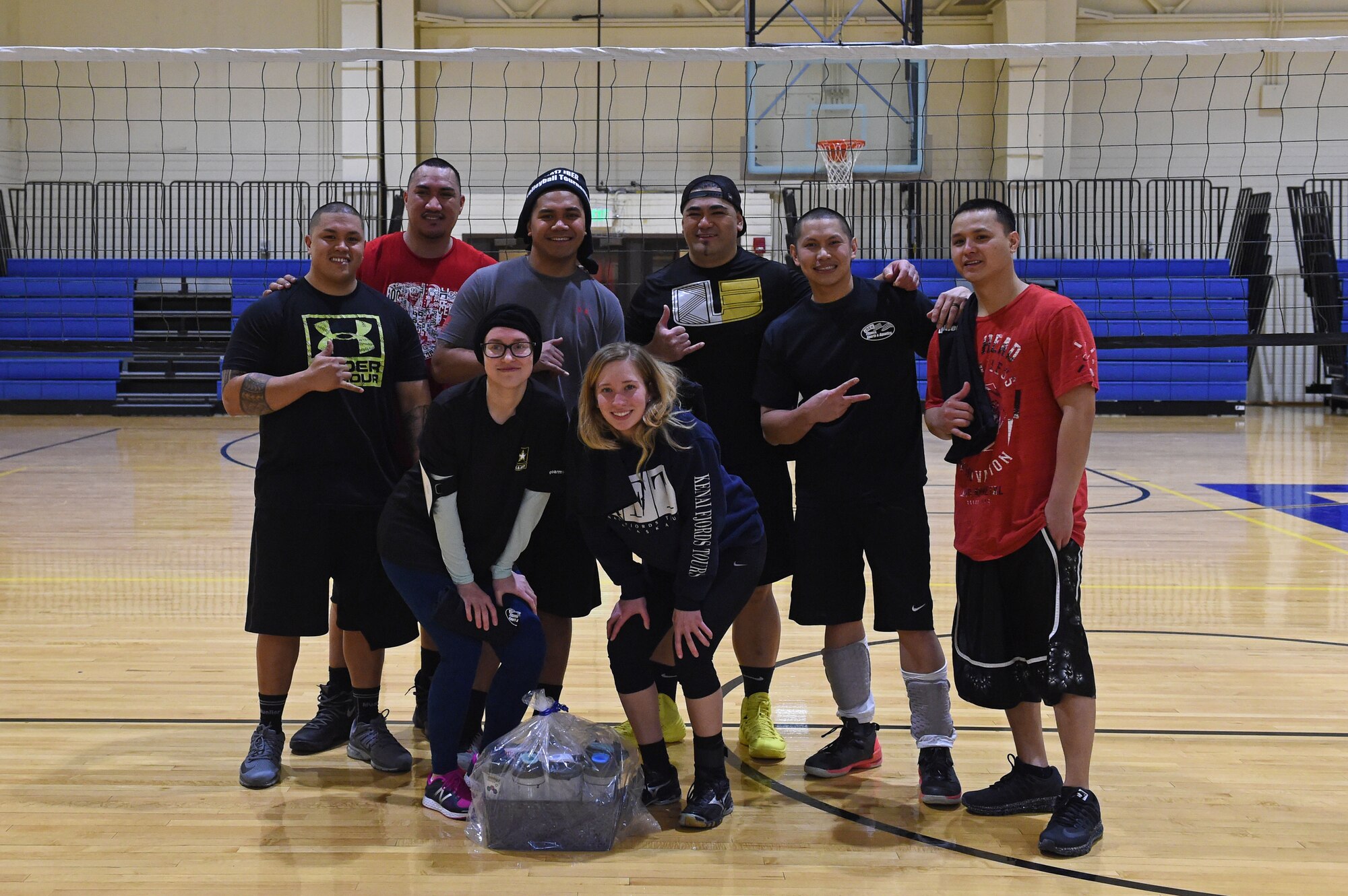Service members participate in a volleyball tournament hosted at the Joint Base Elmendorf-Richardson Fitness Center, Jan. 12, 2017. Six teams competed in the event and prizes were awarded to first and second place as well the best-dressed team. 