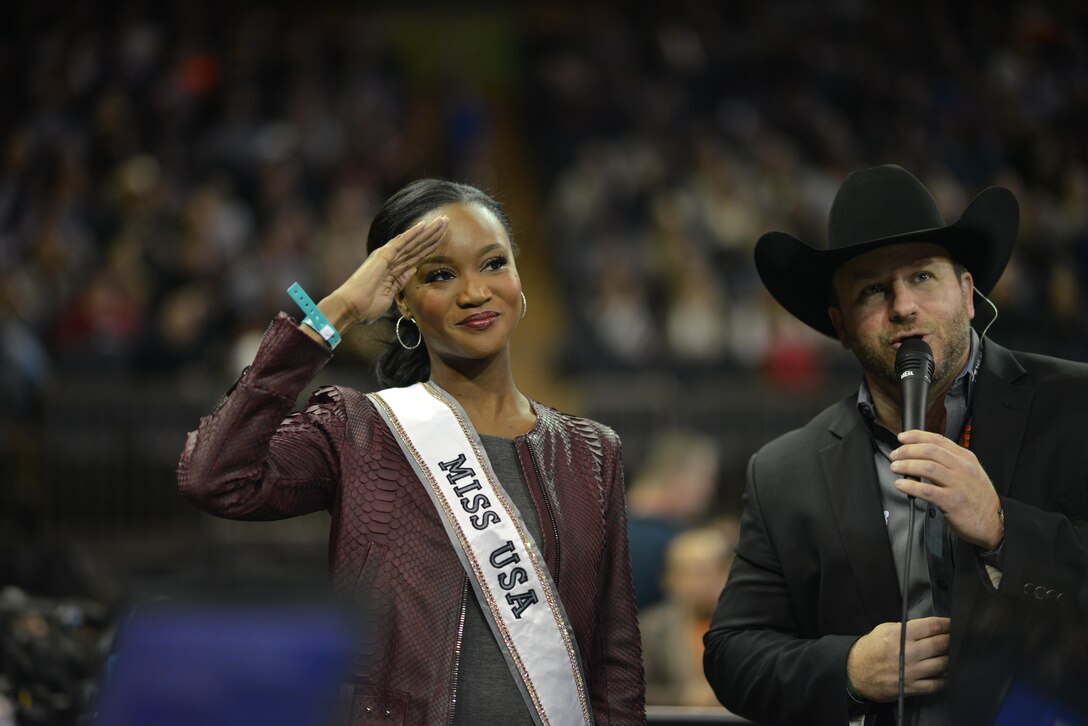 Deshauna Barber, Miss USA and a captain in the U.S. Army Reserve's 988th Quartermaster Detachment at Fort Meade, Maryland, salutes fans at the Professional Bull Rider's Association Rodeo at Madison Square Garden in New York City on January 6, 2017.

Captain Barber is the first military officer to be awarded the title of Miss USA.
