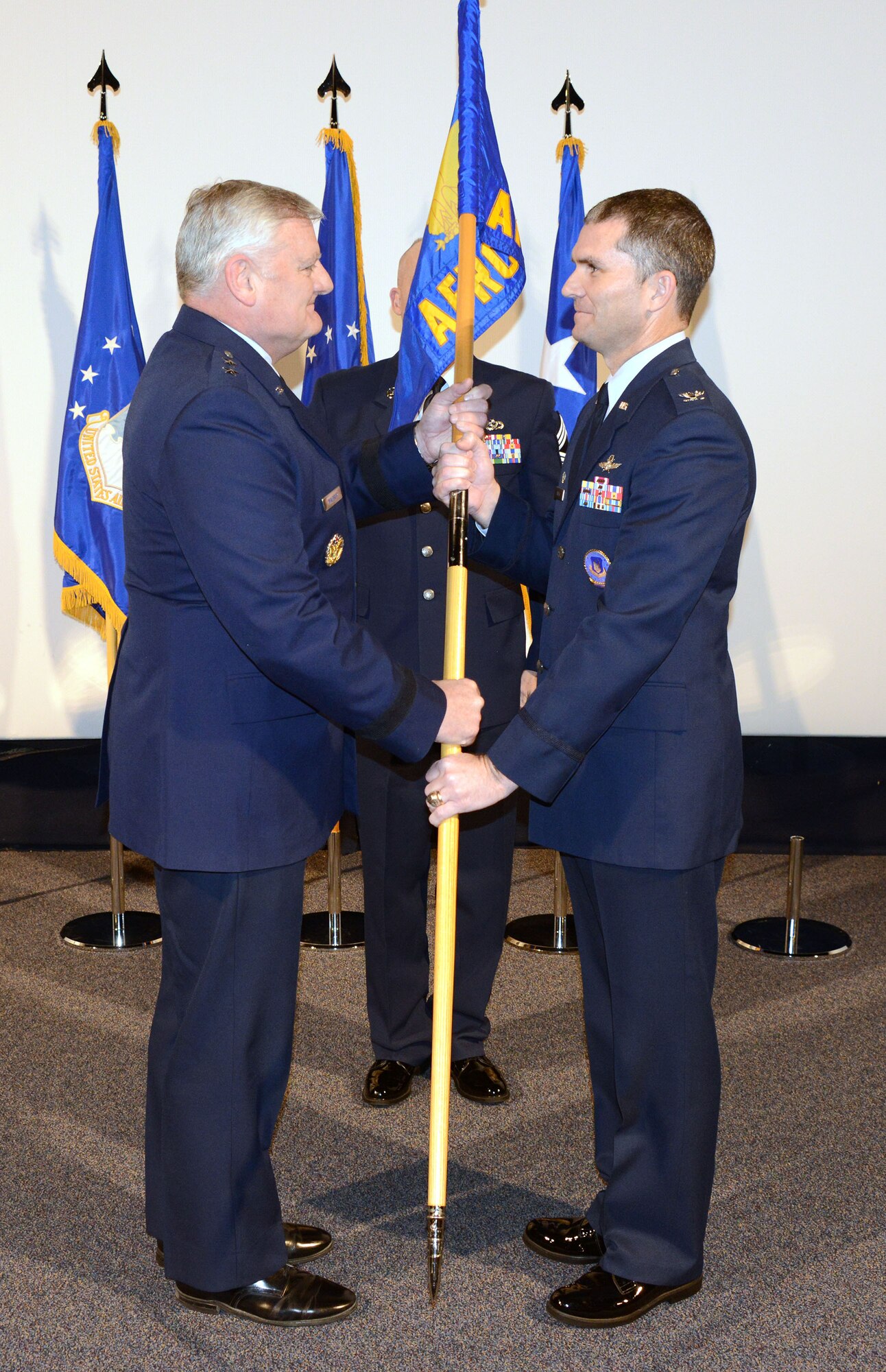 Maj. Gen. William B. Waldrop Jr., vice commander, Air Force Reserve Command passes leadership of AFRC Recruiting Service to Col. Harold W. Linnean III, in a ceremony held at Robins Air Force Base, Georgia. (Air Force photo/Master Sgt. Chance Babin)