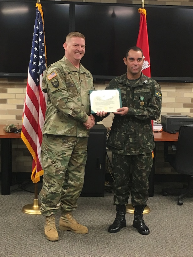 At his farewell ceremony in December, Lt. Col. Nilber Cruz was presented an Army Commendation Medal by ERDC’s Commander Col. Bryan Green for meritorious service while displaying exceptional leadership and technical excellence while working on numerous research projects at ERDC.