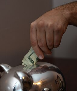 The Army Community Service and Airman and Family Readiness Center at Joint Base Langley-Eustis, Va., provide classes and one-on-one financial education to assist U.S. service members and their families save money and pay off debt. Financial counselors recommend members create an emergency fund, set a goal for their finances and create a budget based on previous spending habits and the financial goals they wish to achieve. (U.S. Air Force photo illustration by Staff Sgt. Teresa J. Cleveland)