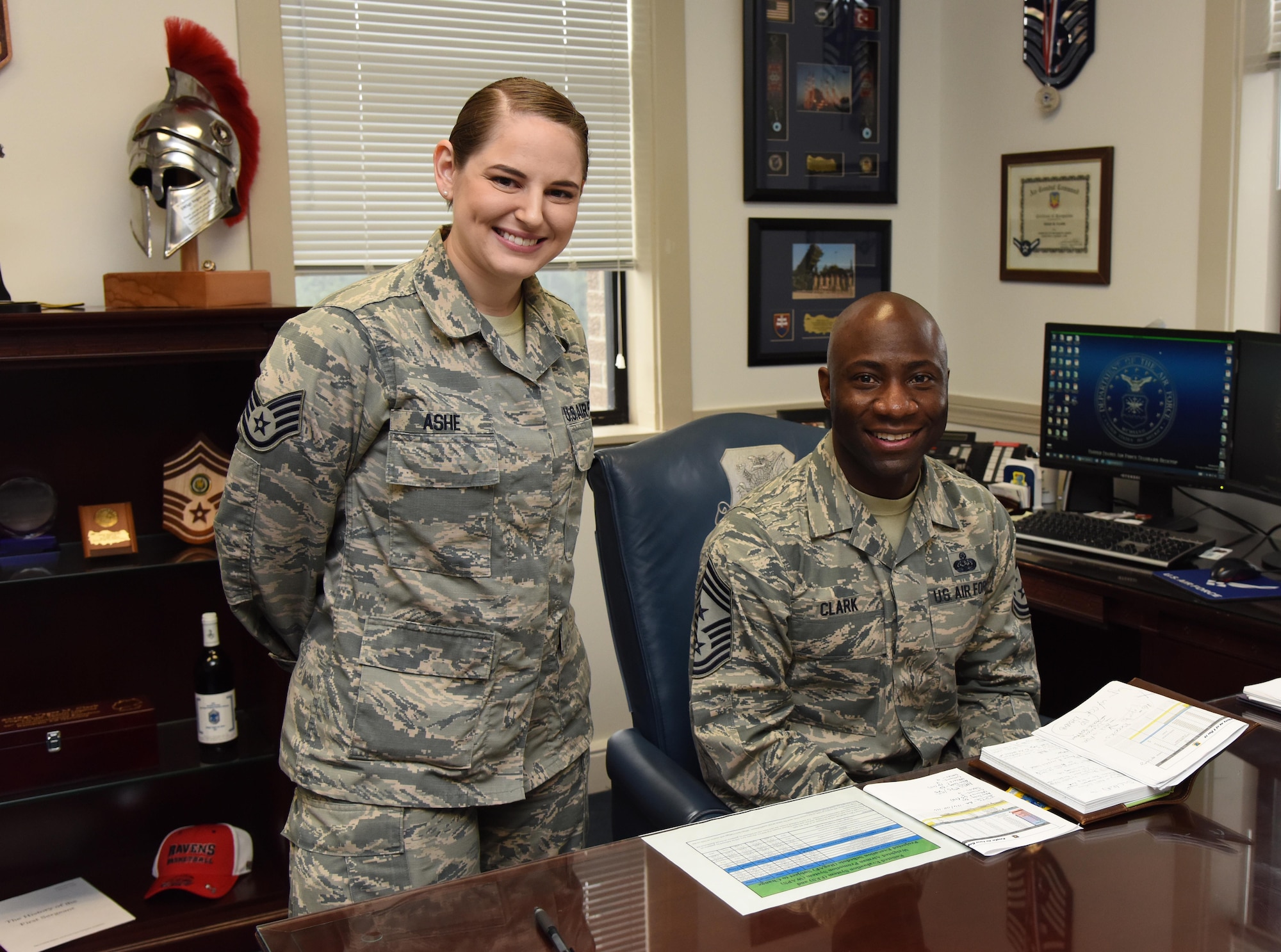 Chief Master Sgt. Vegas Clark, 81st Training Wing command chief, and Staff Sgt. Tayla Ashe, 81st Diagnostic and Therapeutics Squadron blood donor center NCO in charge, pose for a photo in the command chief’s office Jan. 18, 2017, on Keesler Air Force Base, Miss. Ashe participated in the new Command Chief for a Day program which highlights outstanding enlisted performers from around the wing. Each Airman selected for the program spends the day shadowing Clark to learn what it takes to be a command chief. (U.S. Air Force photo by Kemberly Groue)