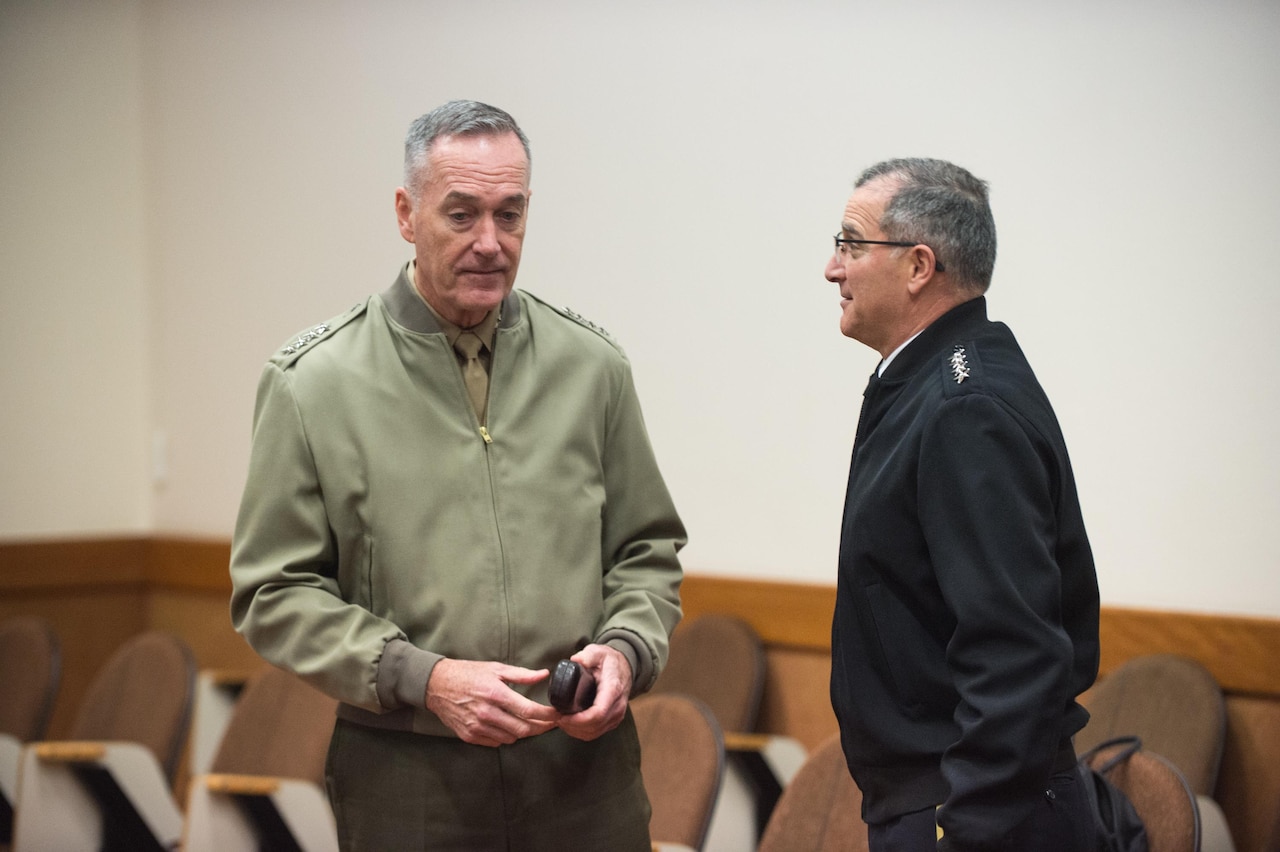 Marine Corps Gen. Joe Dunford, chairman of the Joint Chiefs of Staff, speaks with Army Gen. Curtis M. Scaparrotti, Supreme Allied Commander Europe, before trilateral talks with Turkish Chief of Defense Gen. Hulusi Akar at NATO Headquarters in Brussels, Jan. 17, 2017. The two men were participating in the alliance Military Committee meeting. DoD photo by Army Sgt. James K. McCann