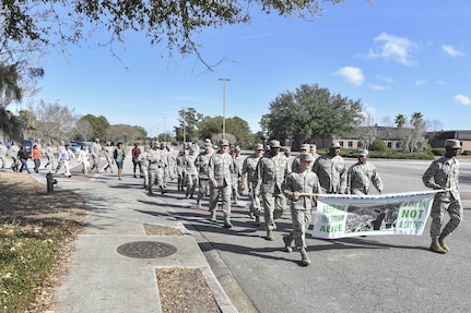 Members of Joint Base Charleston march during the Dr. Martin Luther King Jr. remembrance event at the Air Base Chapel Jan. 17, 2017 at Joint Base Charleston, South Carolina. The ceremony included a march across the base, guest speaker Melvin D. Willis, Space and Naval Warfare Systems Center – Atlantic Enterprise Information Systems Business manager, who spoke about King’s legacy, and a reciting of one of King’s speeches by a local middle school student. 