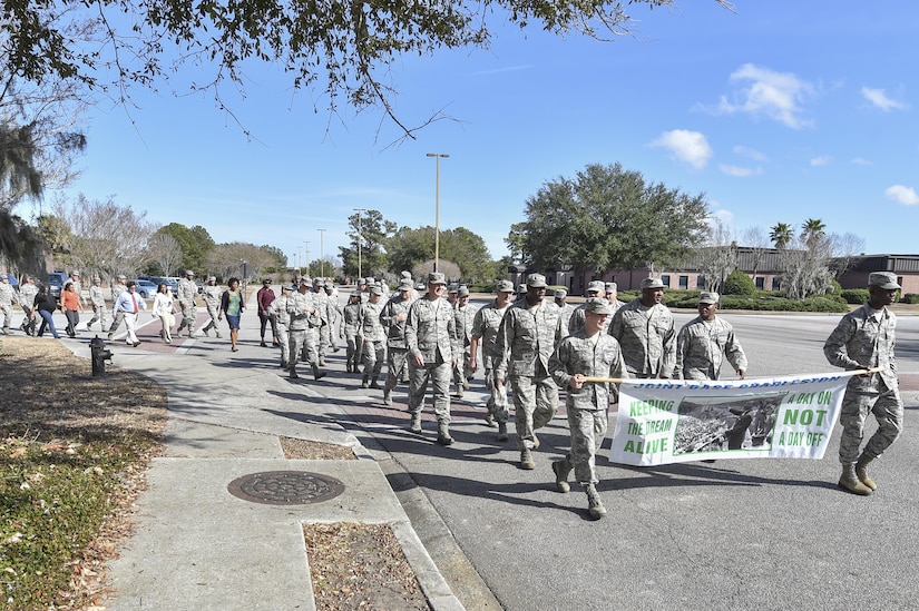 Members of Joint Base Charleston march during the Dr. Martin Luther King Jr. remembrance event at the Air Base Chapel Jan. 17, 2017 at Joint Base Charleston, South Carolina. The ceremony included a march across the base, guest speaker Melvin D. Willis, Space and Naval Warfare Systems Center – Atlantic Enterprise Information Systems Business manager, who spoke about King’s legacy, and a reciting of one of King’s speeches by a local middle school student. 