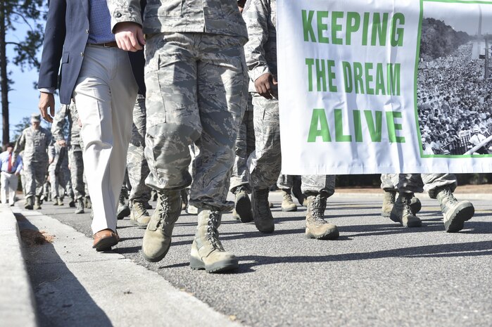 Members of Joint Base Charleston march during the Dr. Martin Luther King Jr. remembrance event at the Air Base Chapel Jan. 17, 2017 at Joint Base Charleston, South Carolina. The ceremony included a march across the base, guest speaker Melvin D. Willis, Space and Naval Warfare Systems Center – Atlantic Enterprise Information Systems Business manager, who spoke about King’s legacy, as well as a reciting of one of King’s speeches by a local middle school student. 