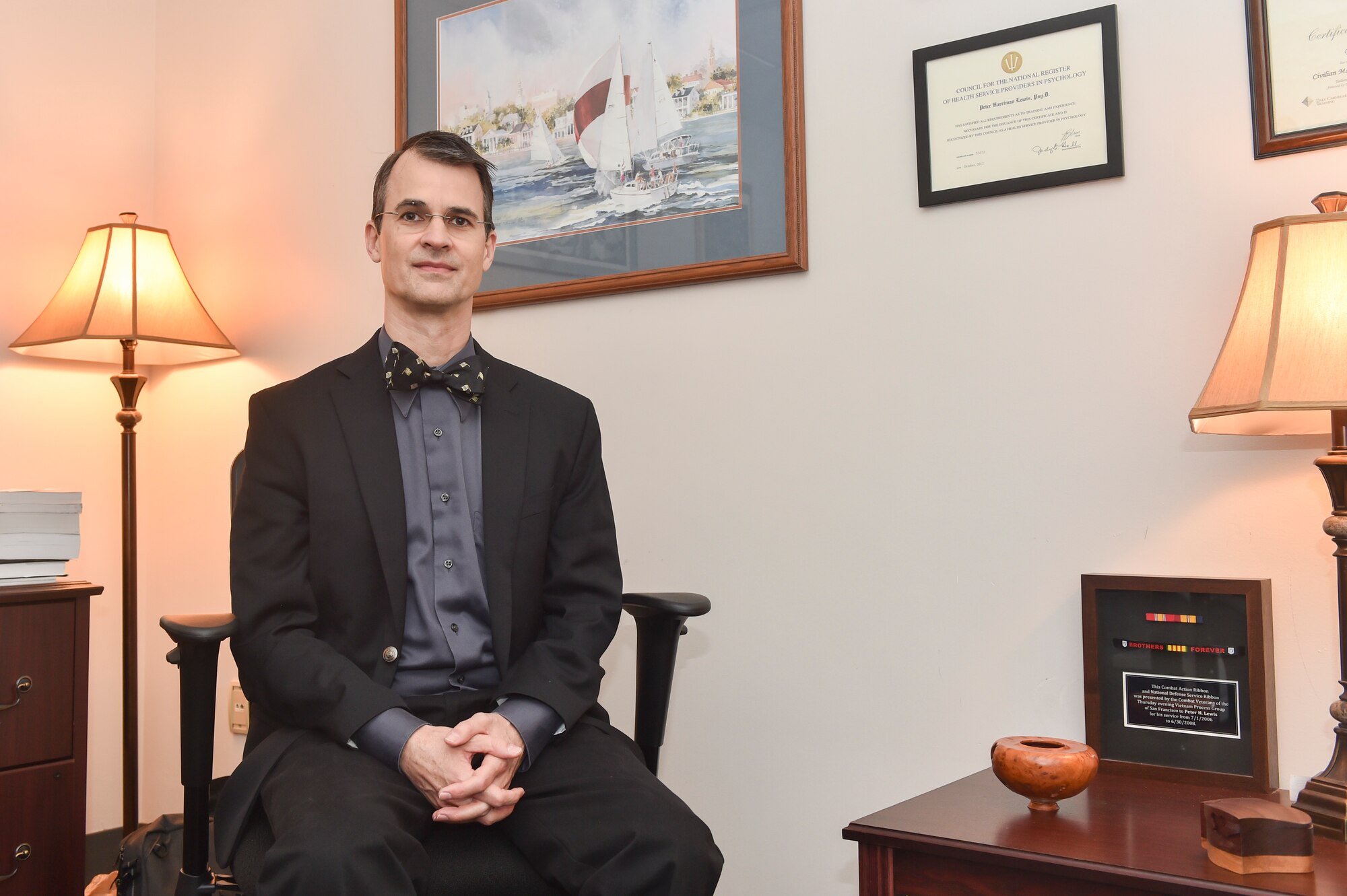 Dr. Peter Lewis, 628th Medical Group clinical psychologist, reflects on his pathway to service in his office Dec. 30, 2016, at Joint Base Charleston, South Carolina. Lewis spent more than 10 years living in a monastery before going back to college to become a psychologist. 