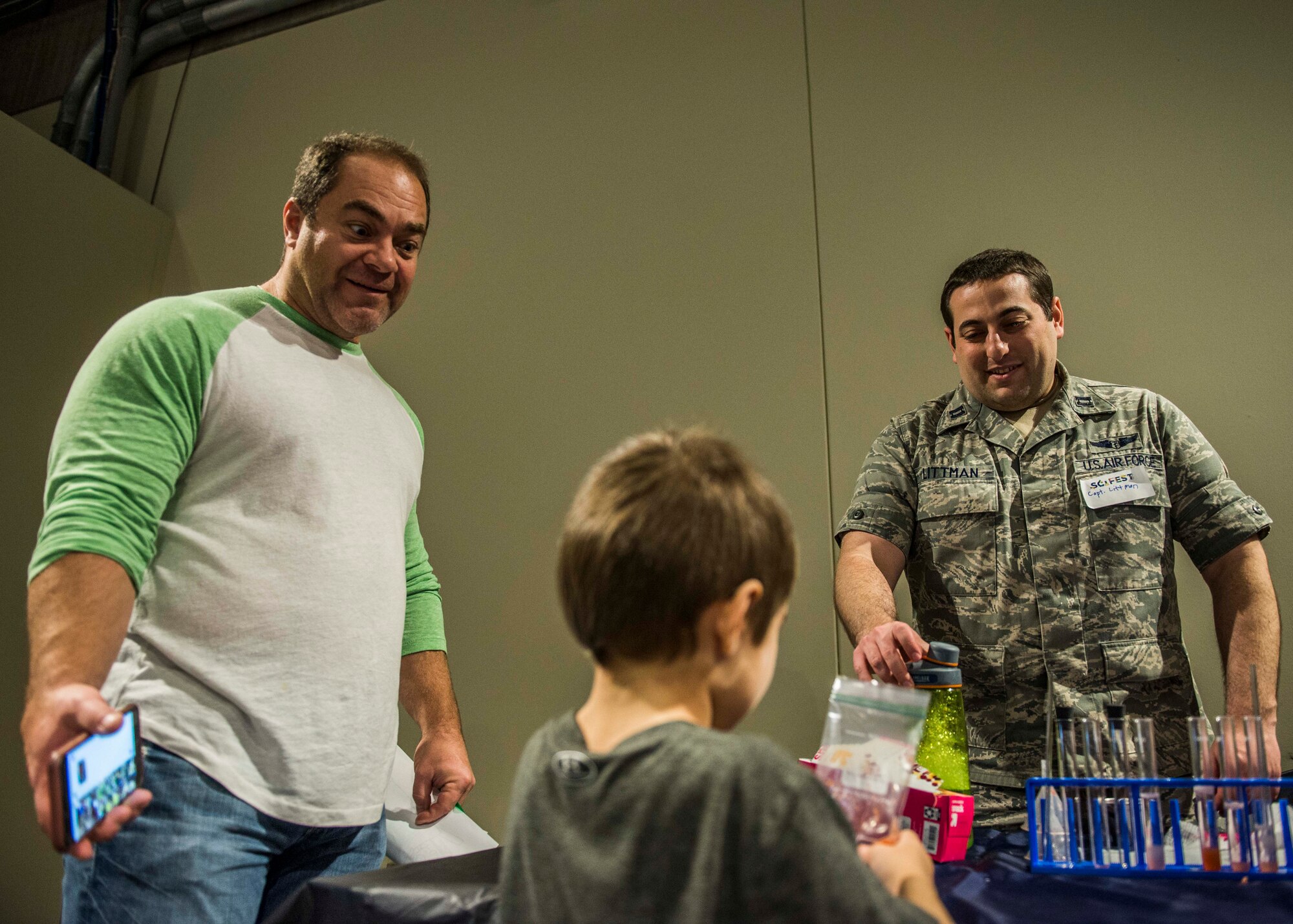 Capt. Nicholas Littman, 375th Aerospace Medicine Squadron, teaches visitors how to extract DNA from a strawberry.  (U.S. Air Force photo by Staff Sgt. Jodi Martinez)