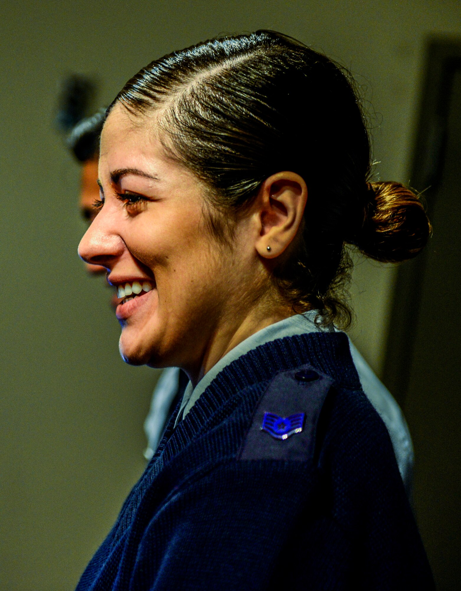 Staff Sgt. Merissa Hunnicut, 345th Recruiting Squadron recruiter, smiles during the Community Science Showcase event. (U.S. Air Force photo by Staff Sgt. Jodi Martinez)