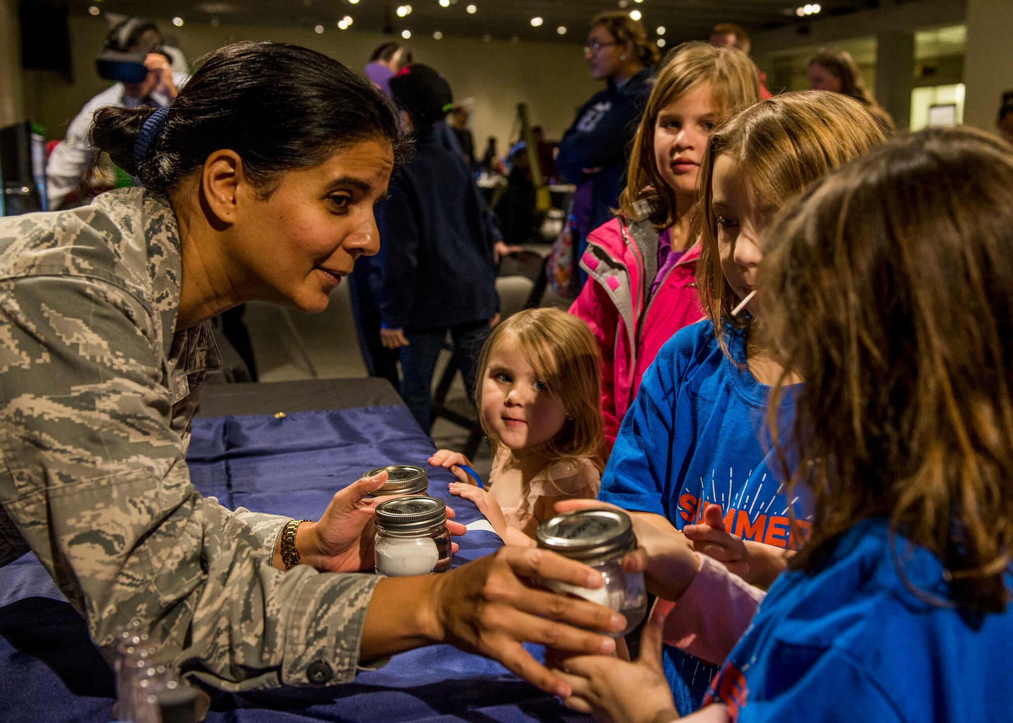 Maj. Anita Shade, 375th Dental Squadron residency director, shows the effects of acid on eggs, much like the effects of acid on teeth during the event. (U.S. Air Force photo by Staff Sgt. Jodi Martinez)