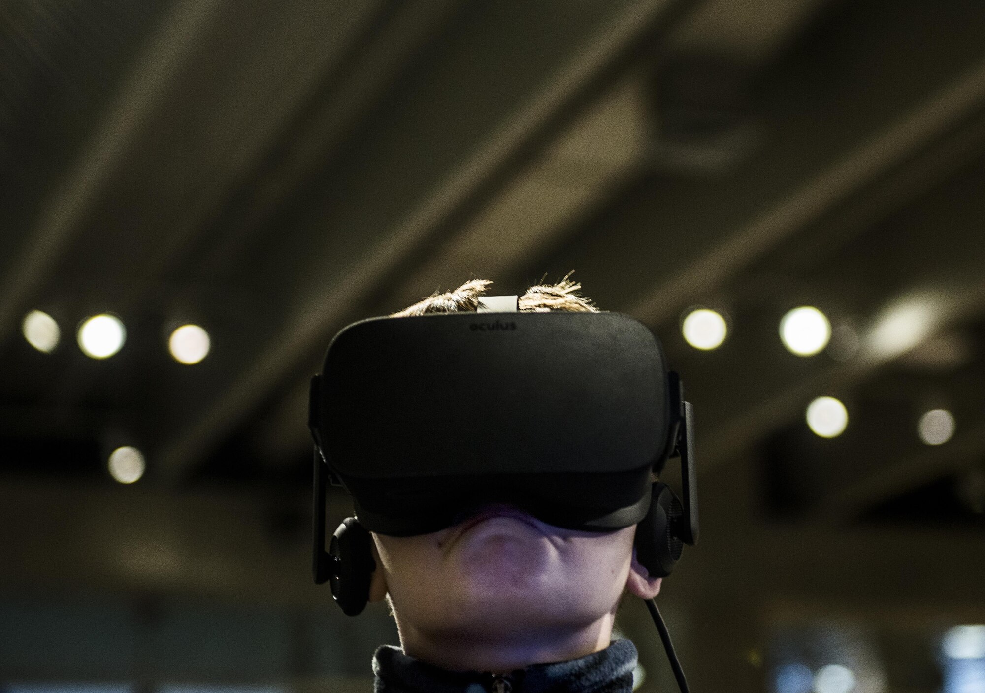 A child experiences a virtual reality scenario during the event. (U.S. Air Force photo by Staff Sgt. Jodi Martinez)