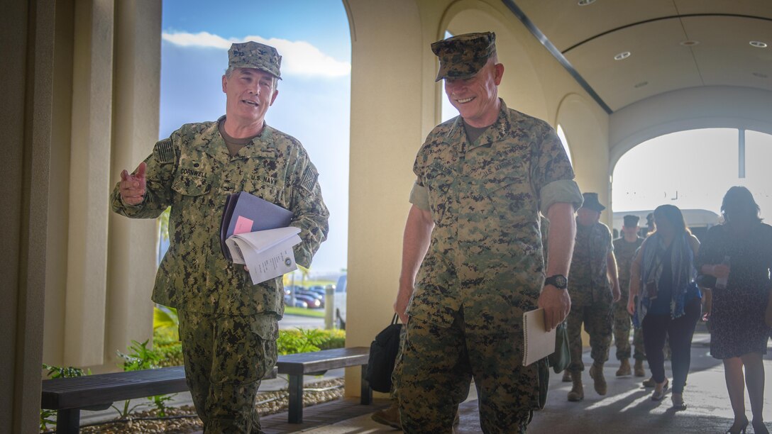 U.S. Marine Corps Lt. Gen. Lawrence Nicholson (right), Commanding General, III Marine Expeditionary Force,  walks into US Naval Hospital Guam (USNH Guam) with the hospital's Commanding Officer, Capt. Dan Cornwell (left).  Lt. Gen. Nicholson visited the hospital to gain a better understanding of Navy Medicine's capabilities on Guam.  (U.S. Navy photo by USNH Guam Public Affairs/Released)