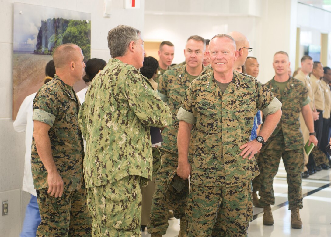 U.S. Marine Corps Lt. Gen. Lawrence Nicholson (right), Commanding General, III Marine Expeditionary Force,  listens as Capt. Dan Cornwell (left), Commanding Officer, US Naval Hospital Guam, explains the layout of the hospital building, which was completed in 2014.  The first floor of the building, which is the main outpatient area, is meant to create a spacious, calming environment.  Lt. Gen. Nicholson visited the hospital to gain a better understanding of Navy Medicine's capabilities on Guam.  