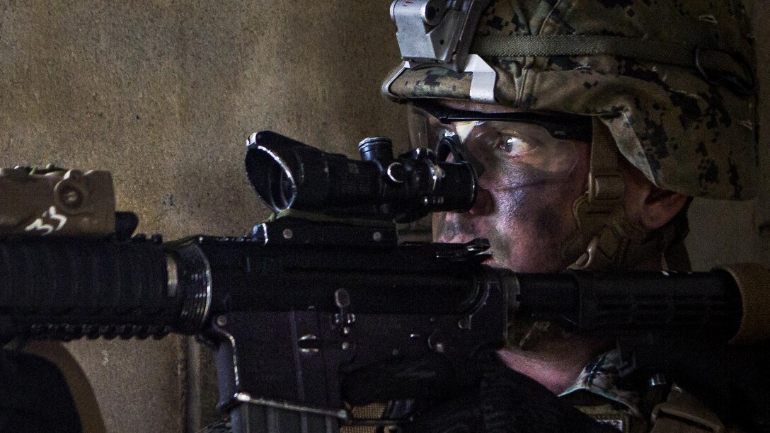 <strong>Photo of the Day: Jan. 19, 2017</strong><br/><br />Marine Cpl. Michael Pimenidis provides security with an M4 carbine while participating in a mechanized raid as part of the Marine Expeditionary Unit Exercise at Marine Corps Base Camp Butler, Okinawa, Japan, Jan. 16, 2017. Pimenidis is a a team leader assigned to Echo Company, Battalion Landing Team, 2nd Battalion, 5th Marine Regiment, 31st Marine Expeditionary Unit. The exercise integrates aviation, ground and logistics elements to build the interoperability between the components of the Marine Air-Ground Task Force. Marine Corps photo by Cpl. Darien J. Bjorndal<br/><br /><a href="http://www.defense.gov/Media/Photo-Gallery?igcategory=Photo%20of%20the%20Day"> Click here to see more Photos of the Day. </a>