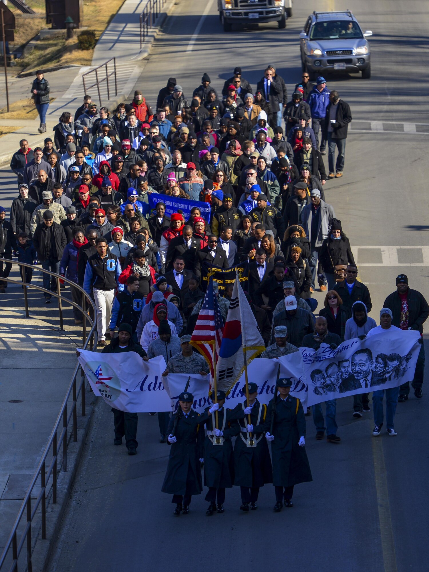 Team Osan members march in the first Rev. Dr. Martin Luther King, Jr., Memorial March at Osan Air Base, Republic of Korea, Jan. 16, 2017. The march was the first organized Martin Luther King Jr. Day march in the history of Osan Air Base. (U.S. Air Force photo by Senior Airman Victor J. Caputo)