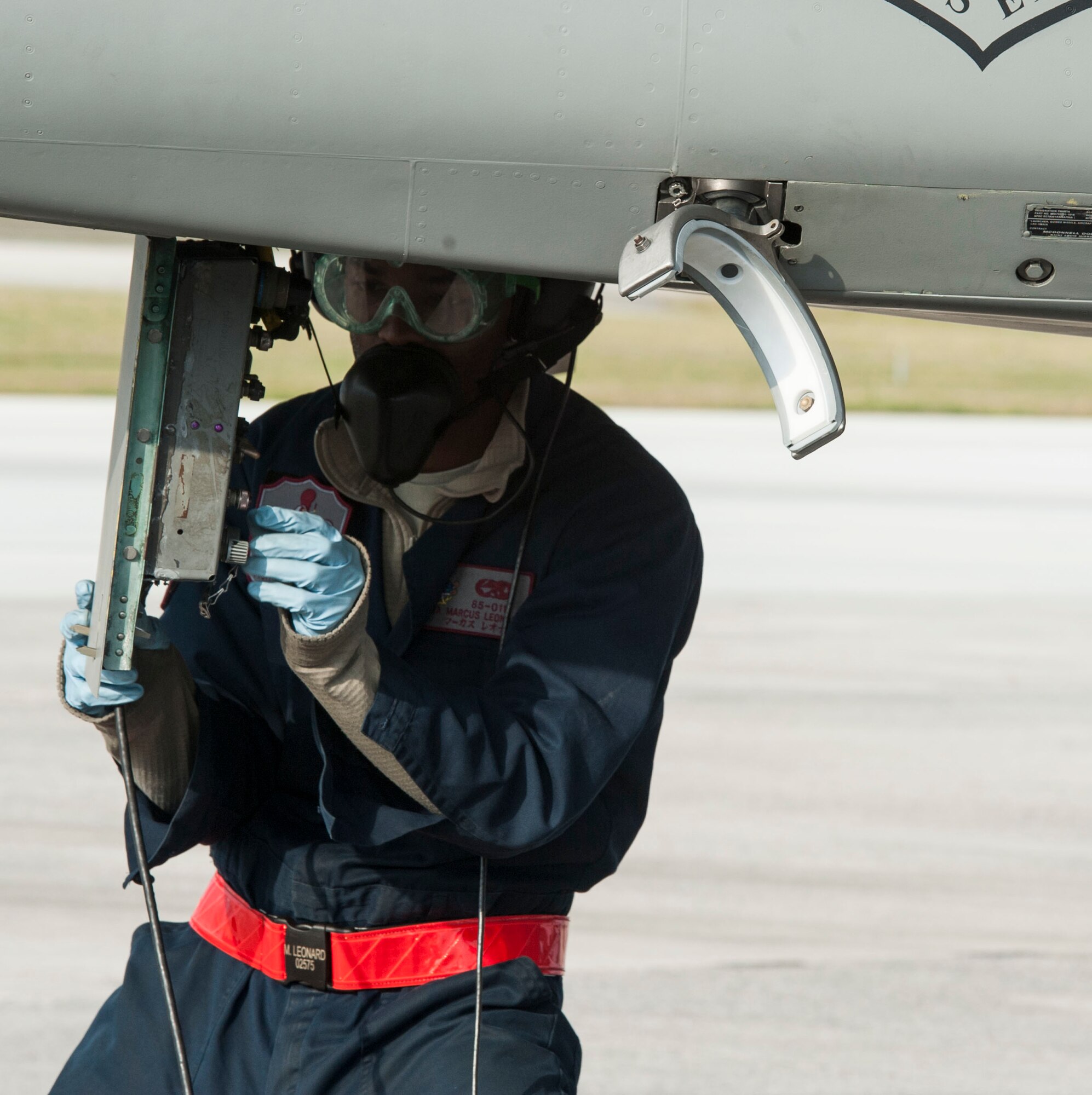 U.S. Air Force Senior Airman Marcus Leonard, 18th Aircraft Maintenance Squadron crew chief, conducts communication system checks during a surge operation Jan. 11, 2017, at Kadena Air Base, Japan. The surge tests the abilities of fighter squadrons to get aircraft airborne in the fastest time possible. (U.S. Air Force photo by Senior Airman Lynette M. Rolen/Released)
