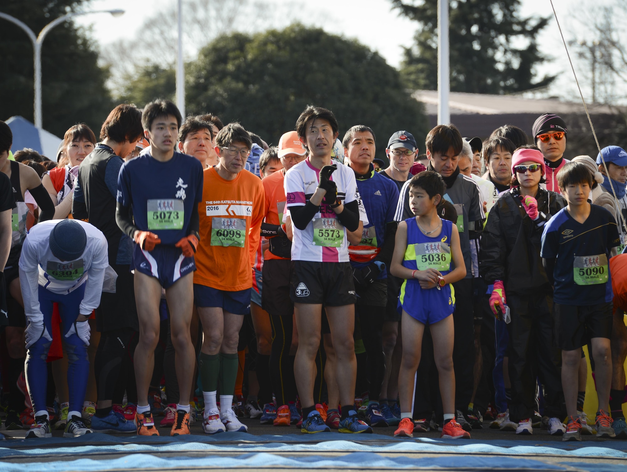Athletes prepare for a 5K Race during the 36th Annual Yokota Striders Frostbite Race at Yokota Air Base, Japan, Jan. 15, 2017. The Frostbite Race, which is ranked one of the top 100 races in Japan according to the Yokota Striders, promotes physical fitness and friendship with Japanese Nationals. (U.S. Air Force photo by Senior Airman Baker)