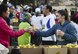 A volunteer offers water to 36th Annual Yokota Striders Frostbite Race participants who have just completed the 5K Race at Yokota Air Base, Japan, Jan. 15, 2017. The Frostbite Race, which is ranked one of the top 100 races in Japan, promotes physical fitness and friendship with Japanese Nationals. (U.S. Air Force photo by Senior Airman Baker)