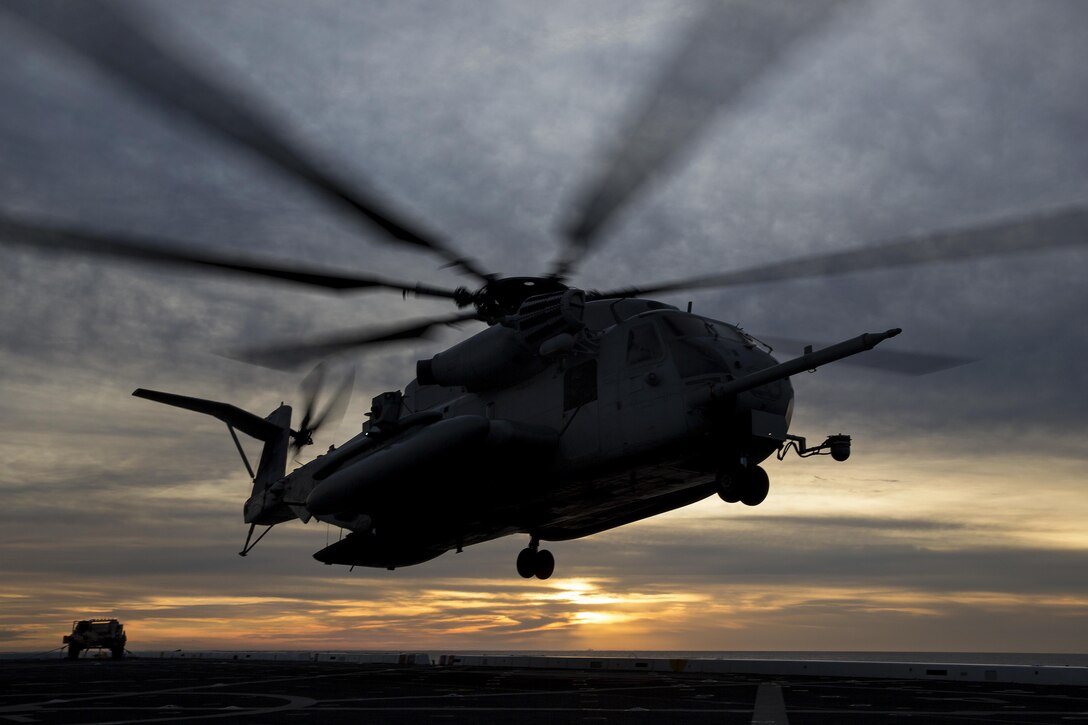 An CH-53K Super Stallion departs from the USS Mesa Verde to return Marines and sailors from a simulated noncombatant evacuation mission during a Composite Training Unit Exercise at sea, Jan. 17, 2017. The exercise increases operational efficiency before deployment. The helicopter is assigned to Marine Medium Tiltrotor Squadron 365, 24th Marine Expeditionary Unit. Marine Corps photo by Cpl. Hernan Vidana