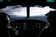 Capt. Johnathan Bonilla, 459th Airlift Squadron standards and evaluations chief, left, and Capt. Vincente Vasquez, 459 AS aircraft commander, fly over a drop zone near Mt. Fuji, Japan, Jan. 13, 2017. Having the hoist allows the 459 AS to conduct rescue missions in small, tight areas throughout the Kanto Plains. (U.S. Air Force photo by Staff Sgt. David Owsianka)