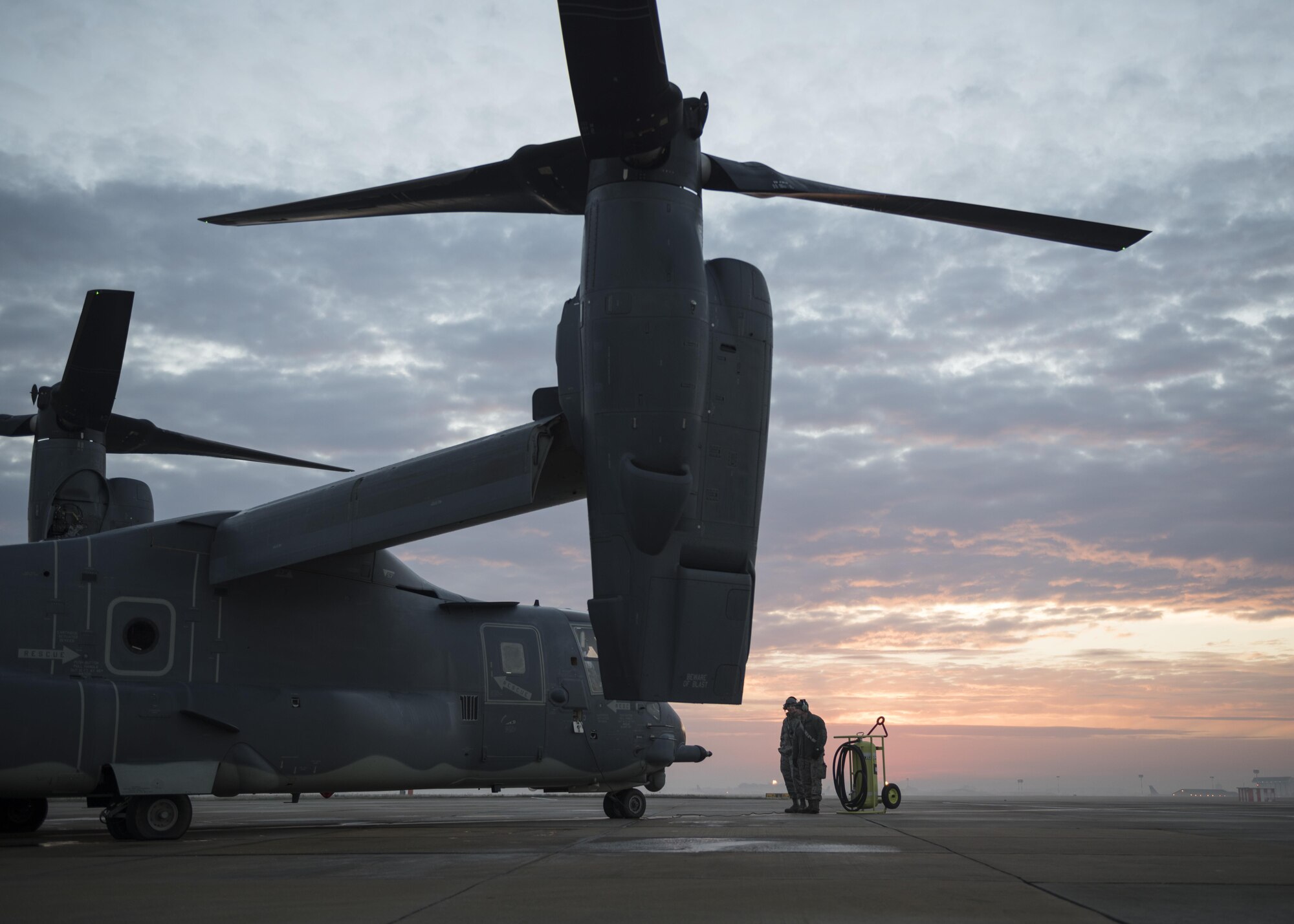 Crew chiefs from the 352d Special Operations Maintenance Squadron communicate with an aircrew from the 7th Special Operations Squadron as they prepare to startup a CV-22 Osprey Jan. 17, 2017 on RAF Mildenhall, England. Maintenance personnel and aircrew work closely together before and after every flight to keep the CV-22 capable of bringing a combination of speed and vertical-lift capability not met by any other existing fixed-or rotary-wing platform. (U.S. Air Force photo by 1st Lt Chris Sullivan)